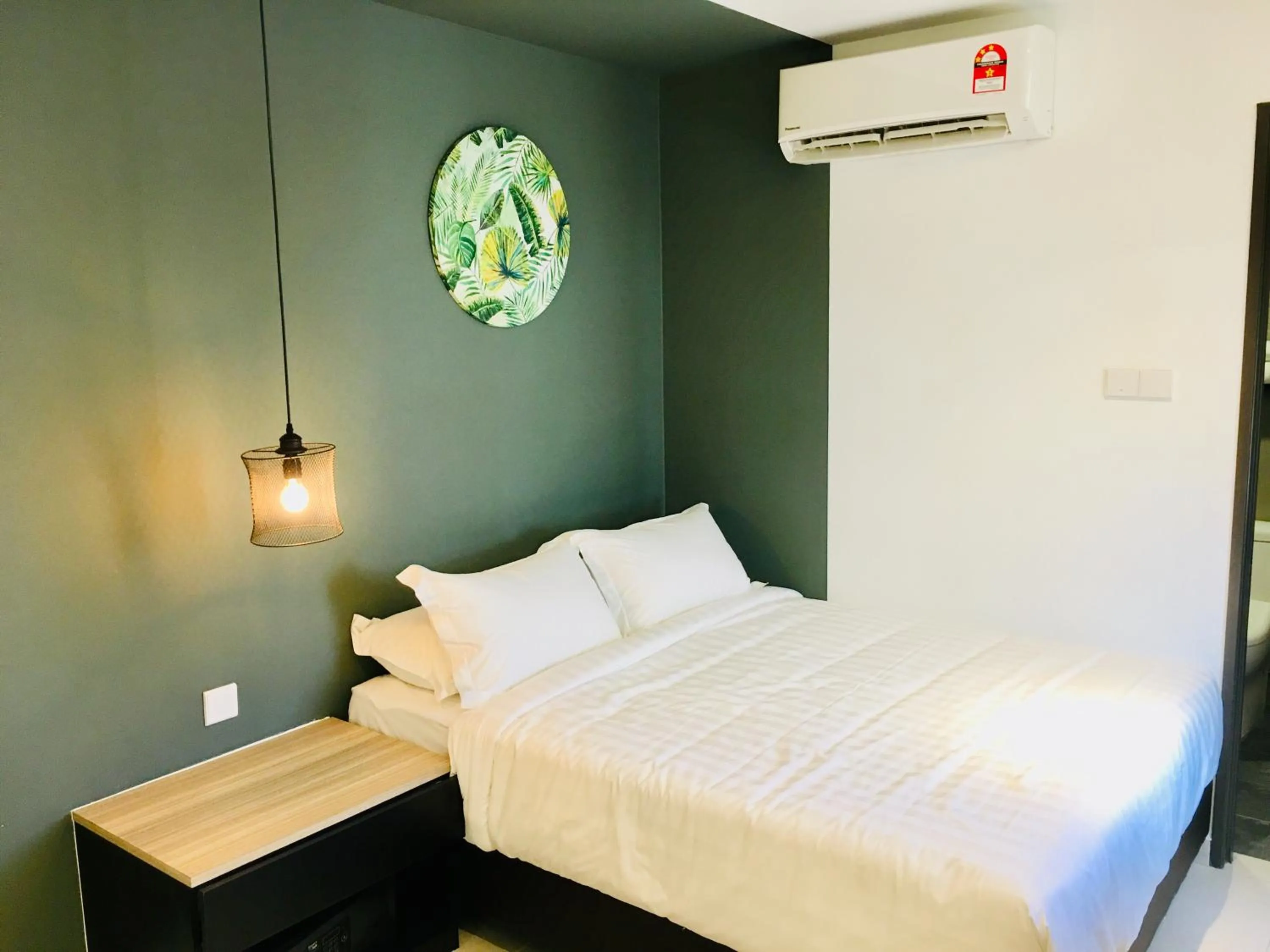 Bed in Enclave Business Hotel