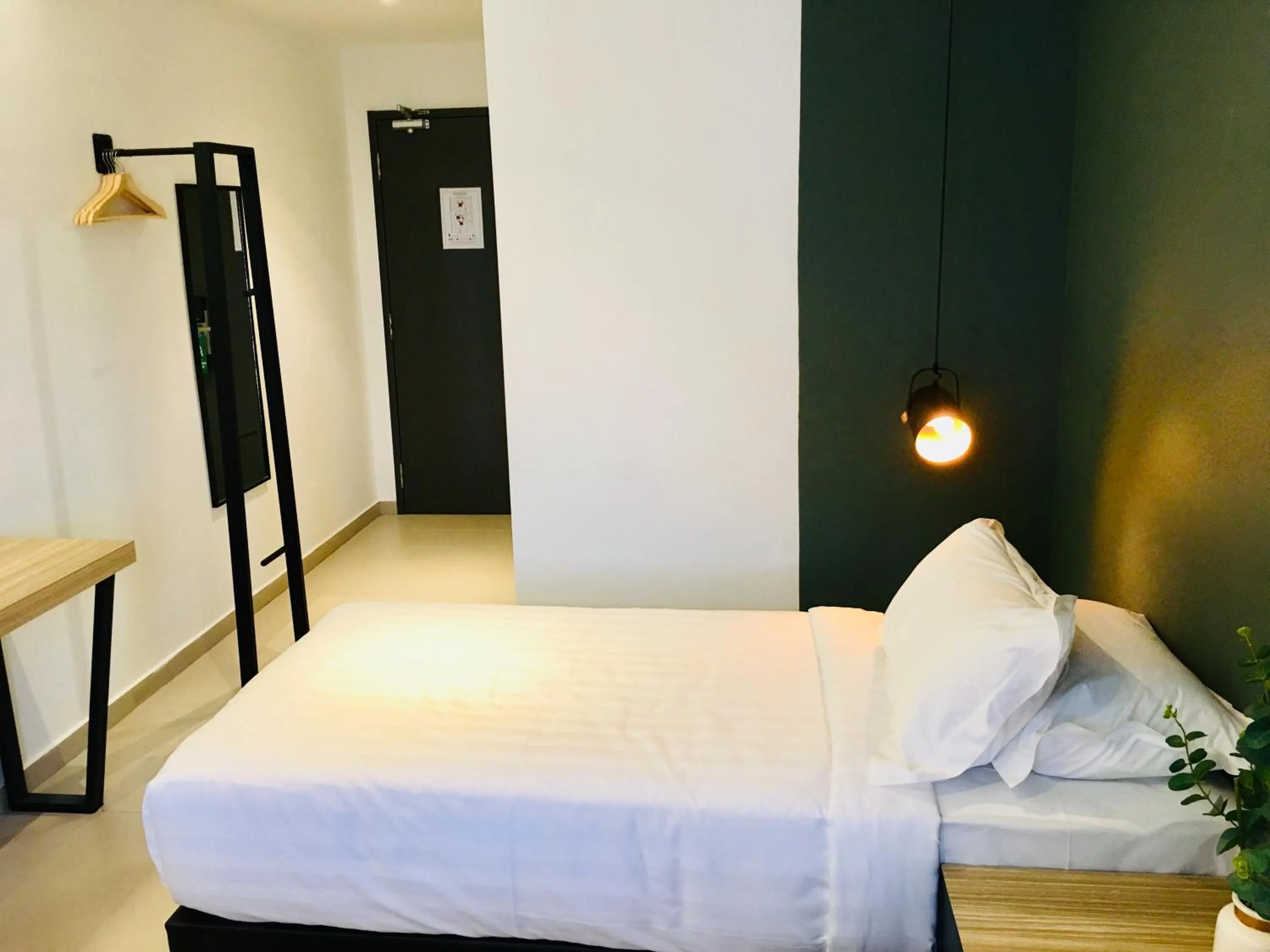 Bed in Enclave Business Hotel