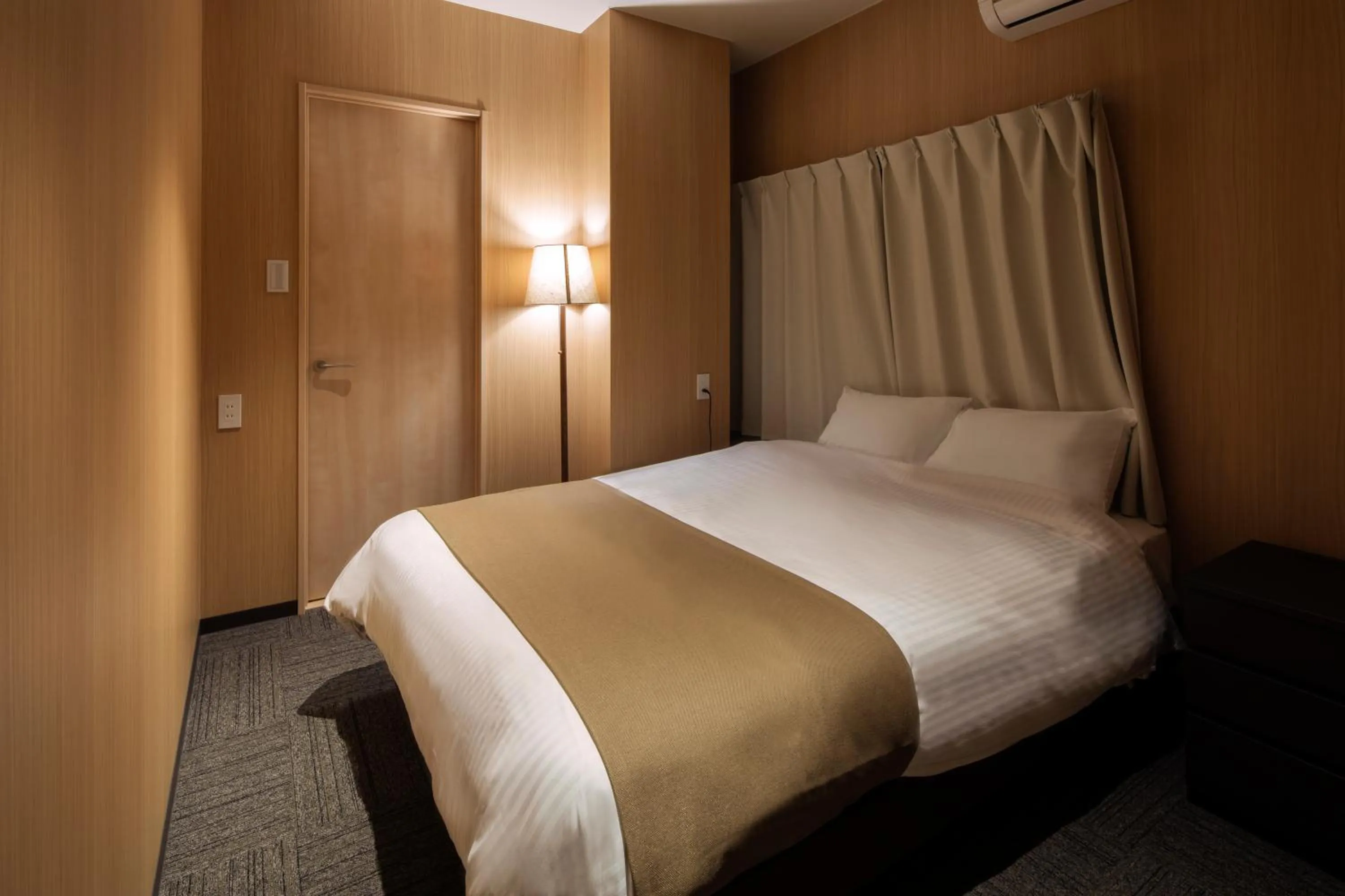 Photo of the whole room, Bed in Randor Residence Hiroshima Suites