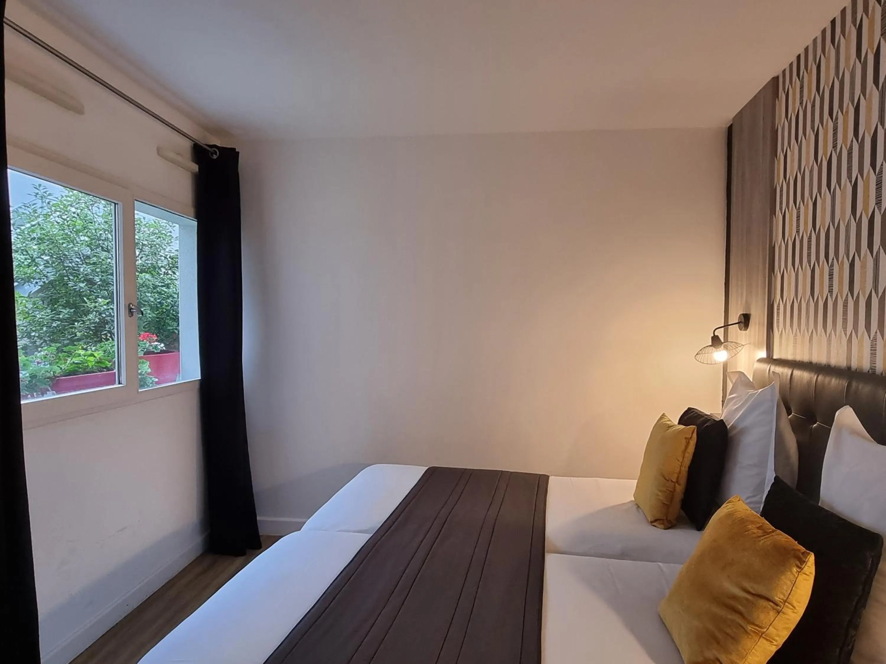 Bed in City Loft Apparthotel