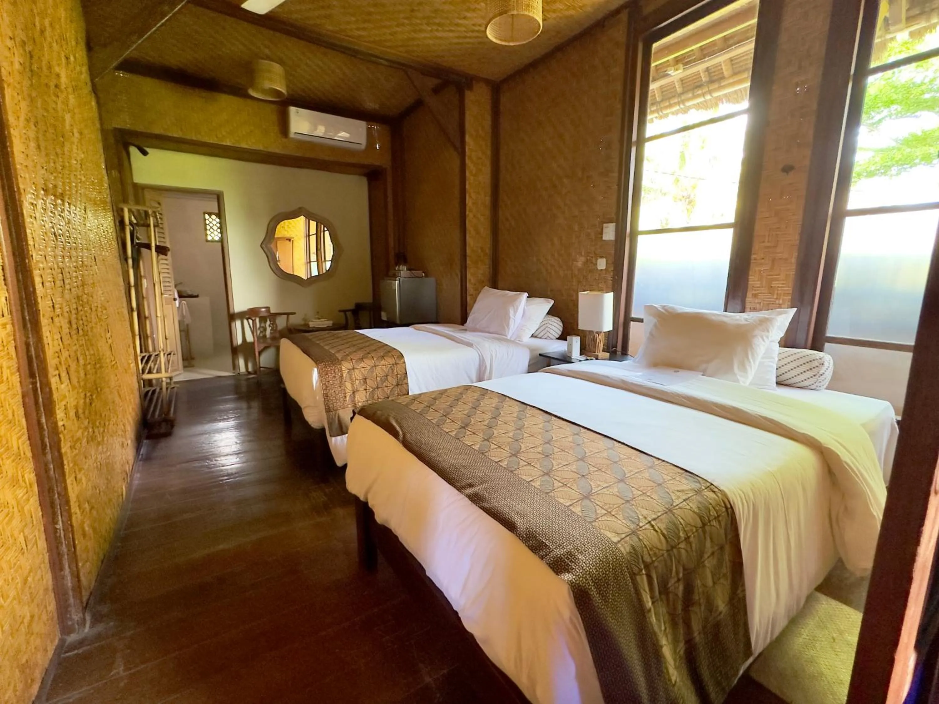 Bed in Aashaya Jasri Resort