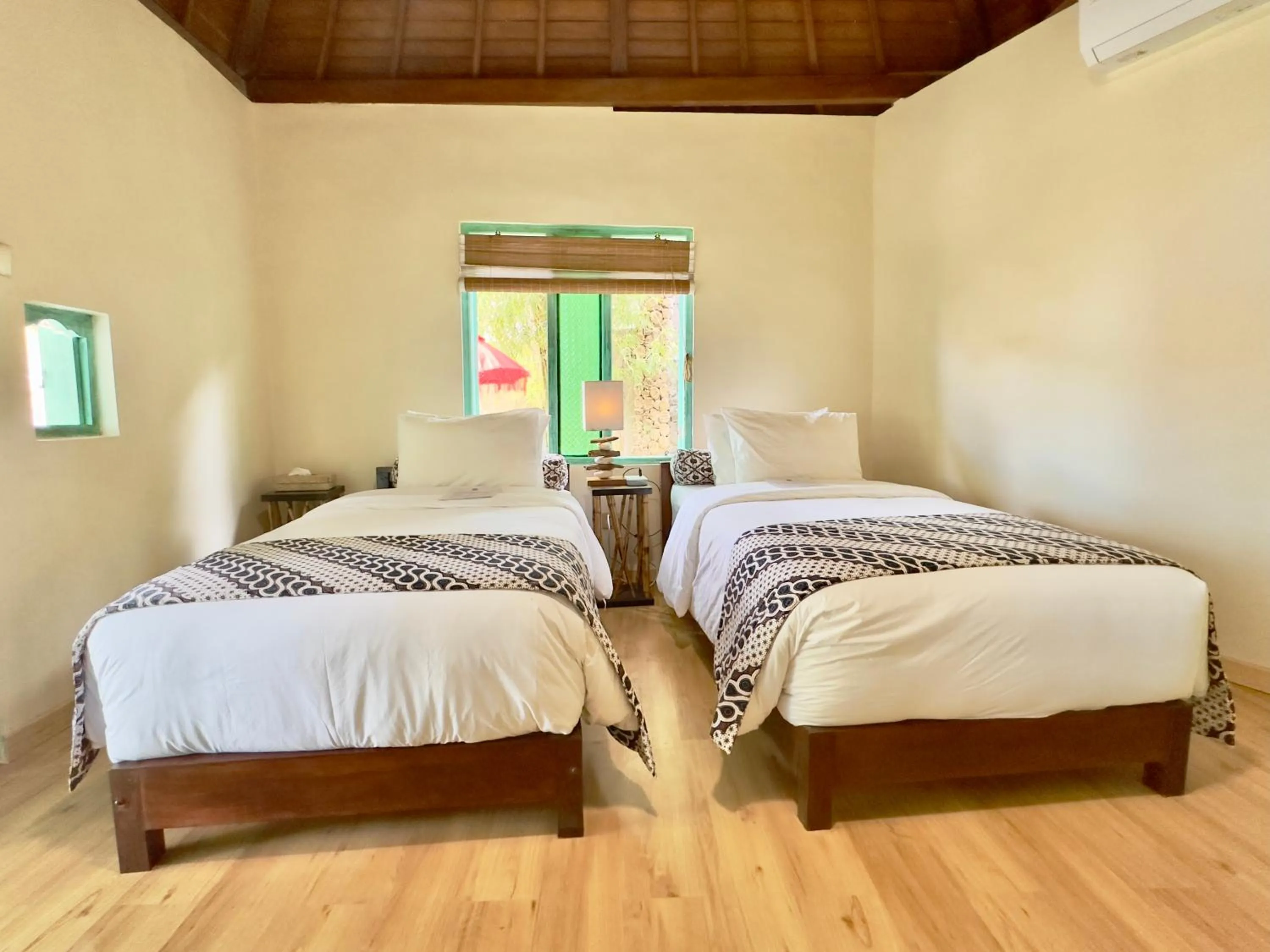 Bed in Aashaya Jasri Resort