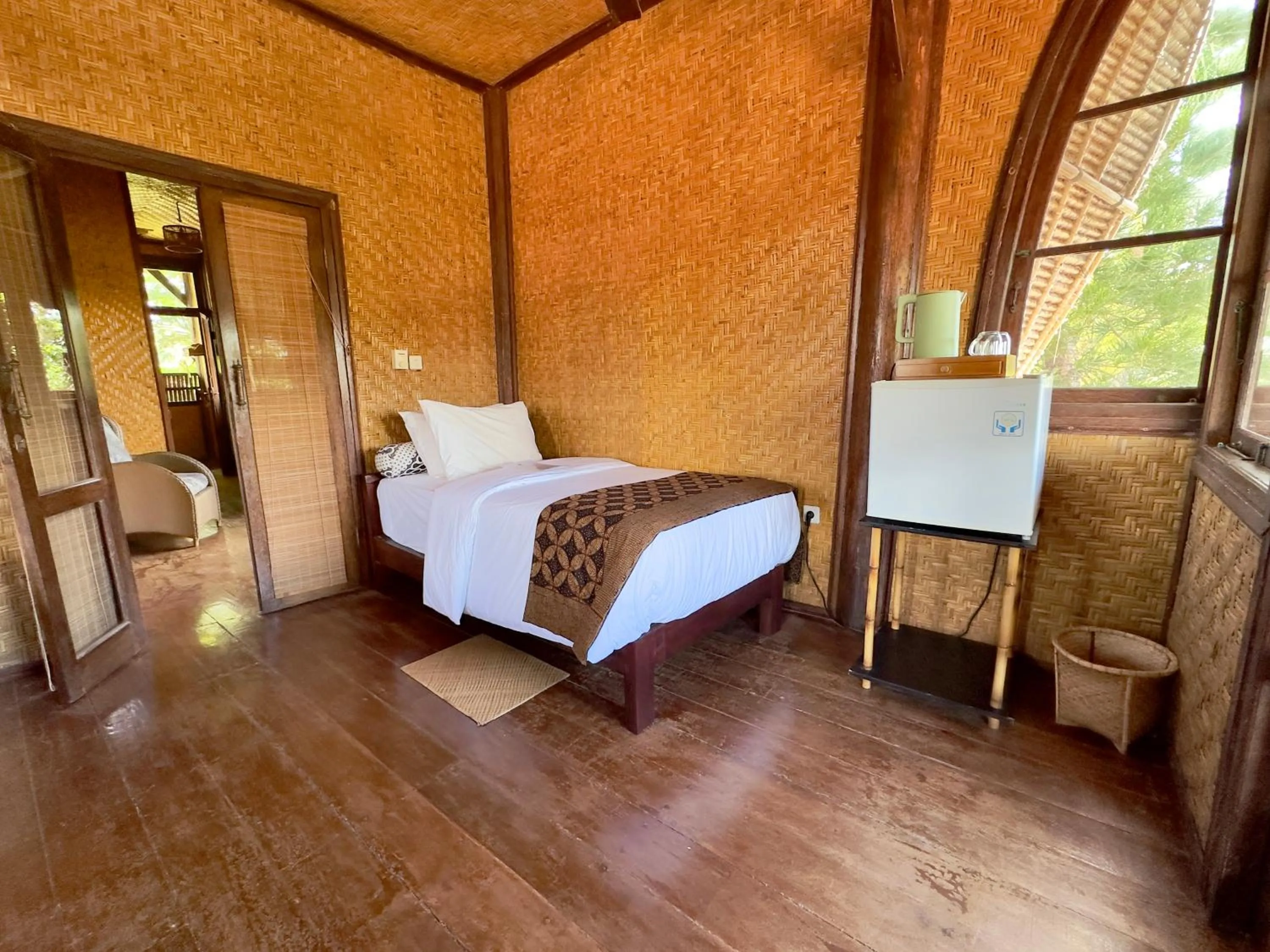 Bed in Aashaya Jasri Resort
