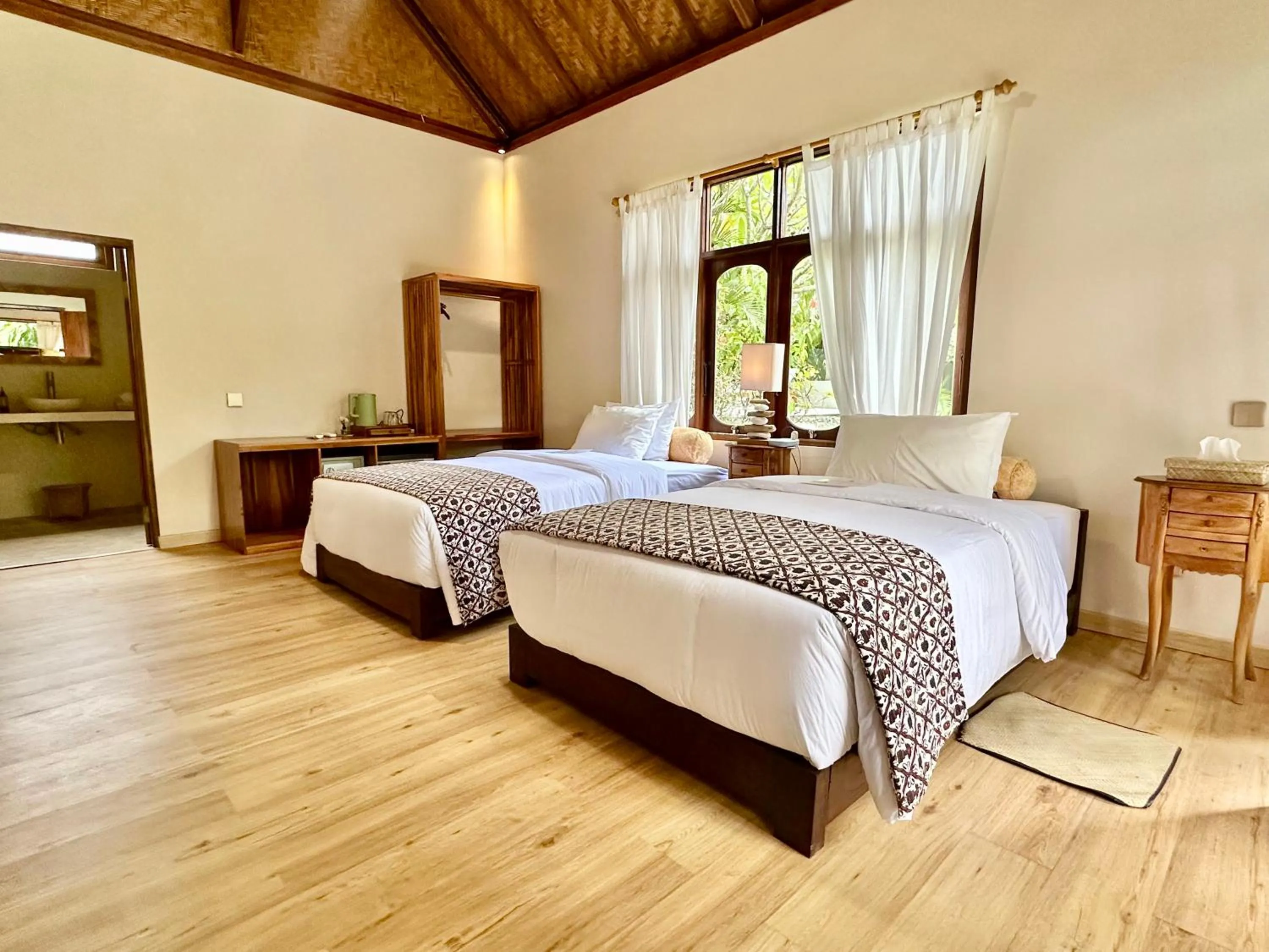Bed in Aashaya Jasri Resort