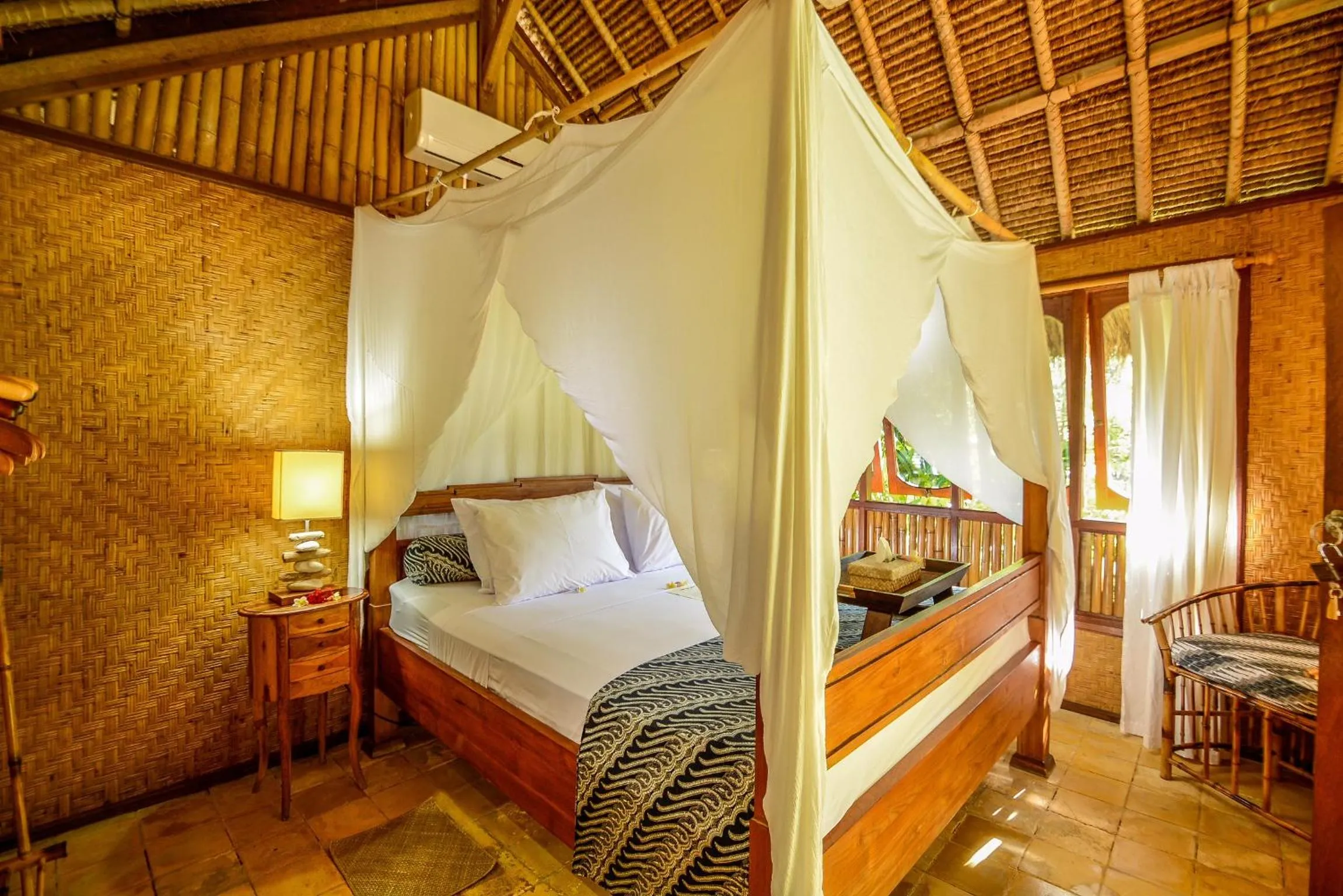 Bed in Aashaya Jasri Resort