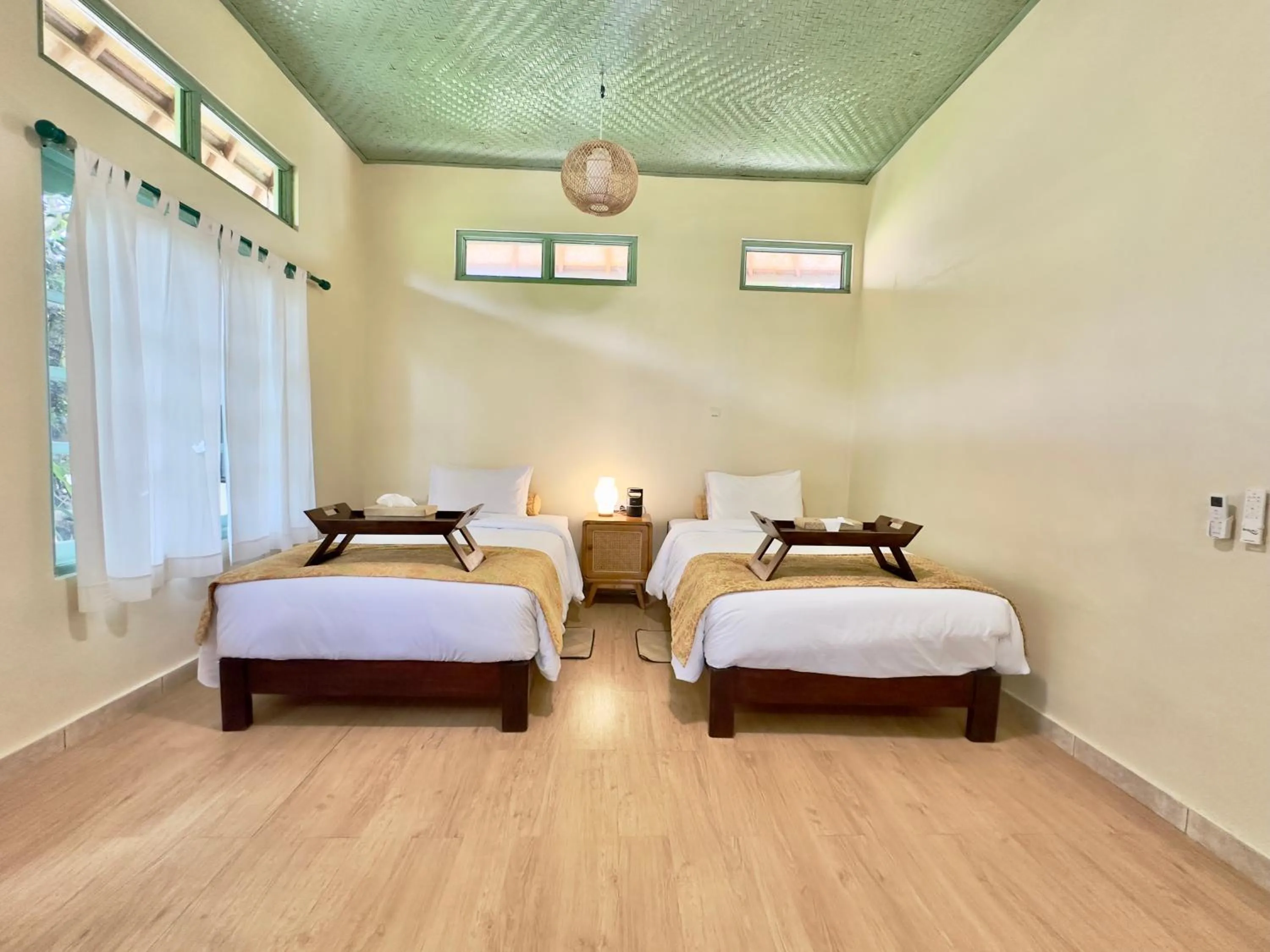 Bed in Aashaya Jasri Resort