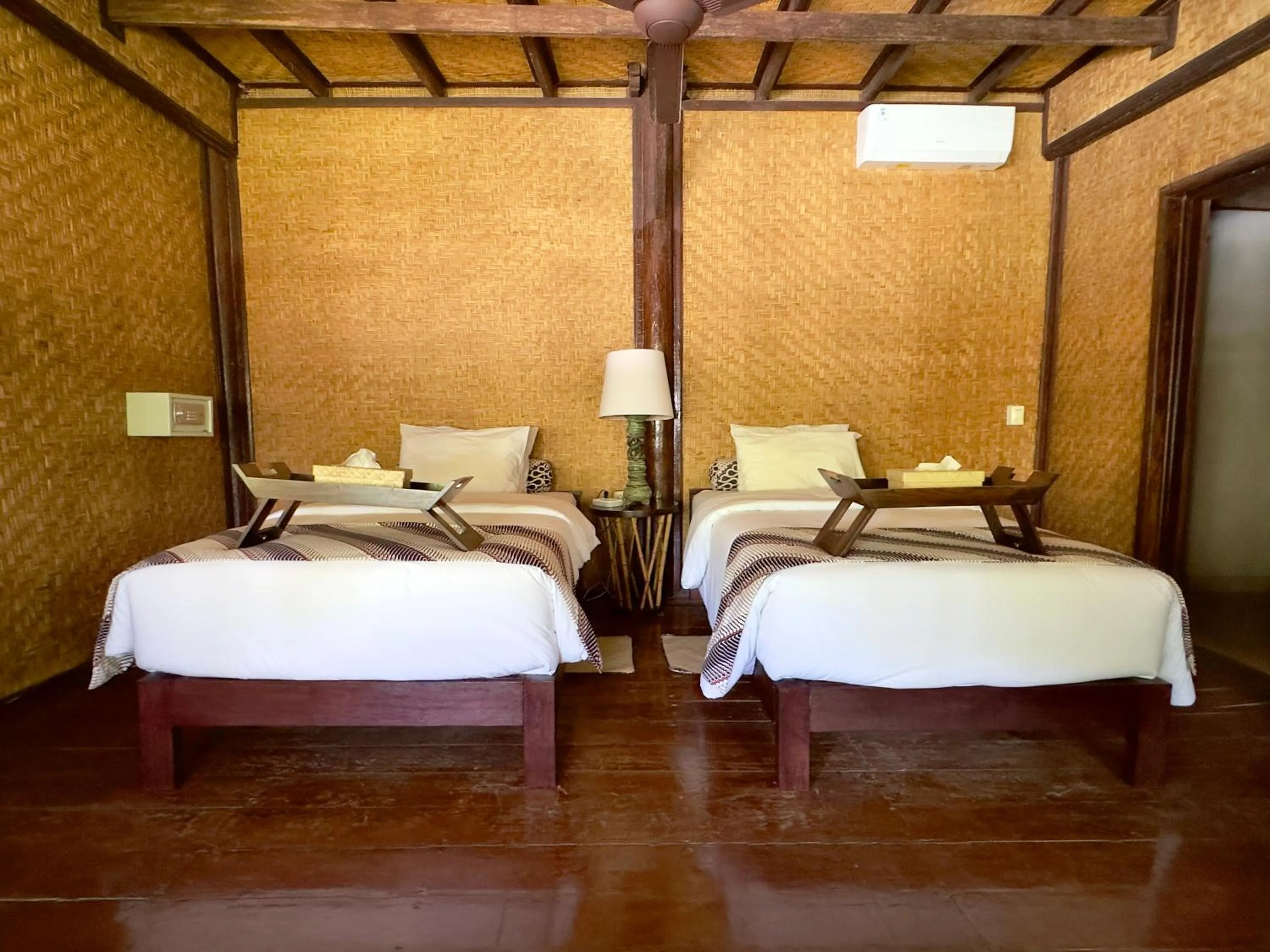 Bed in Aashaya Jasri Resort