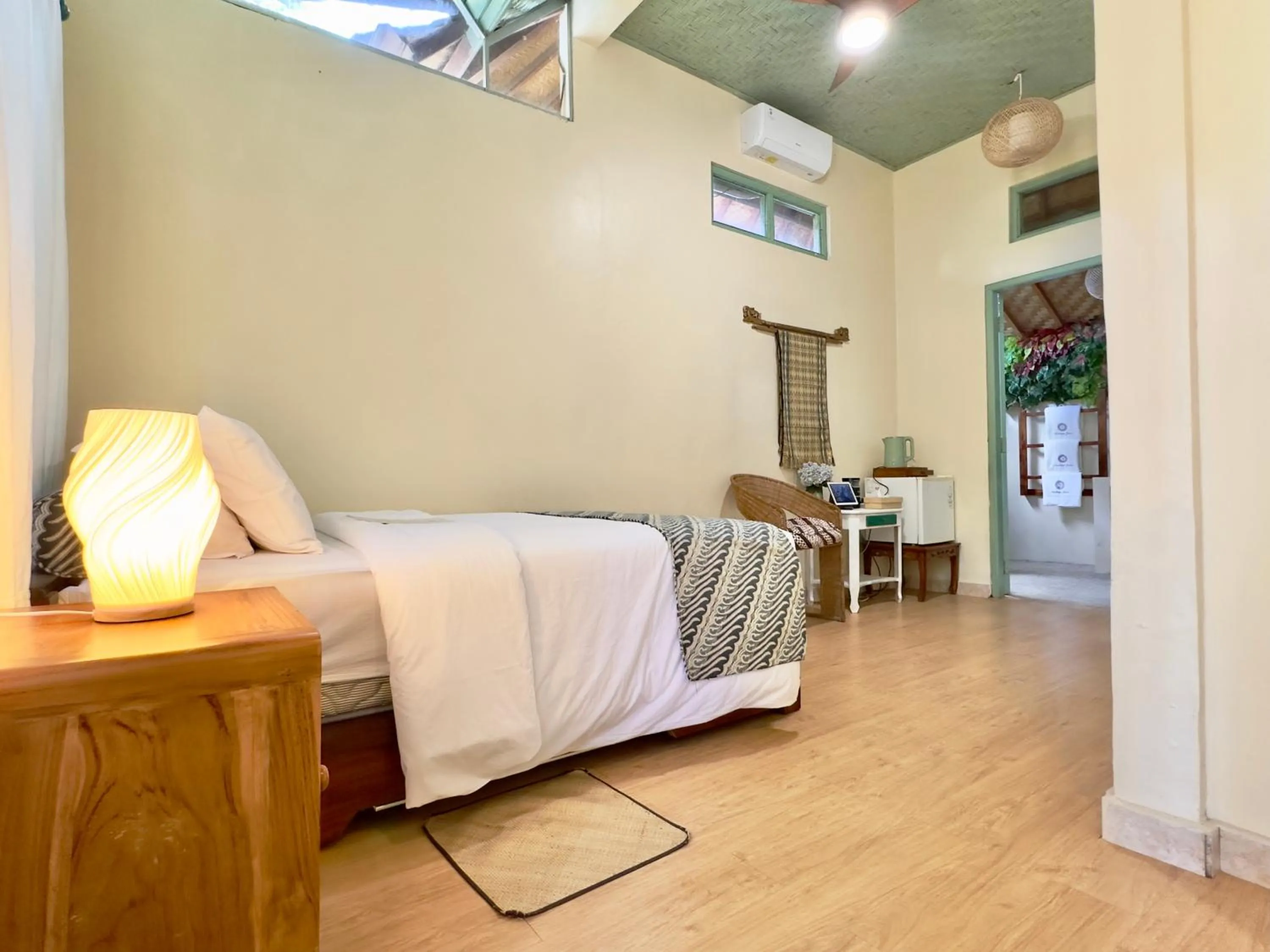 Bed in Aashaya Jasri Resort