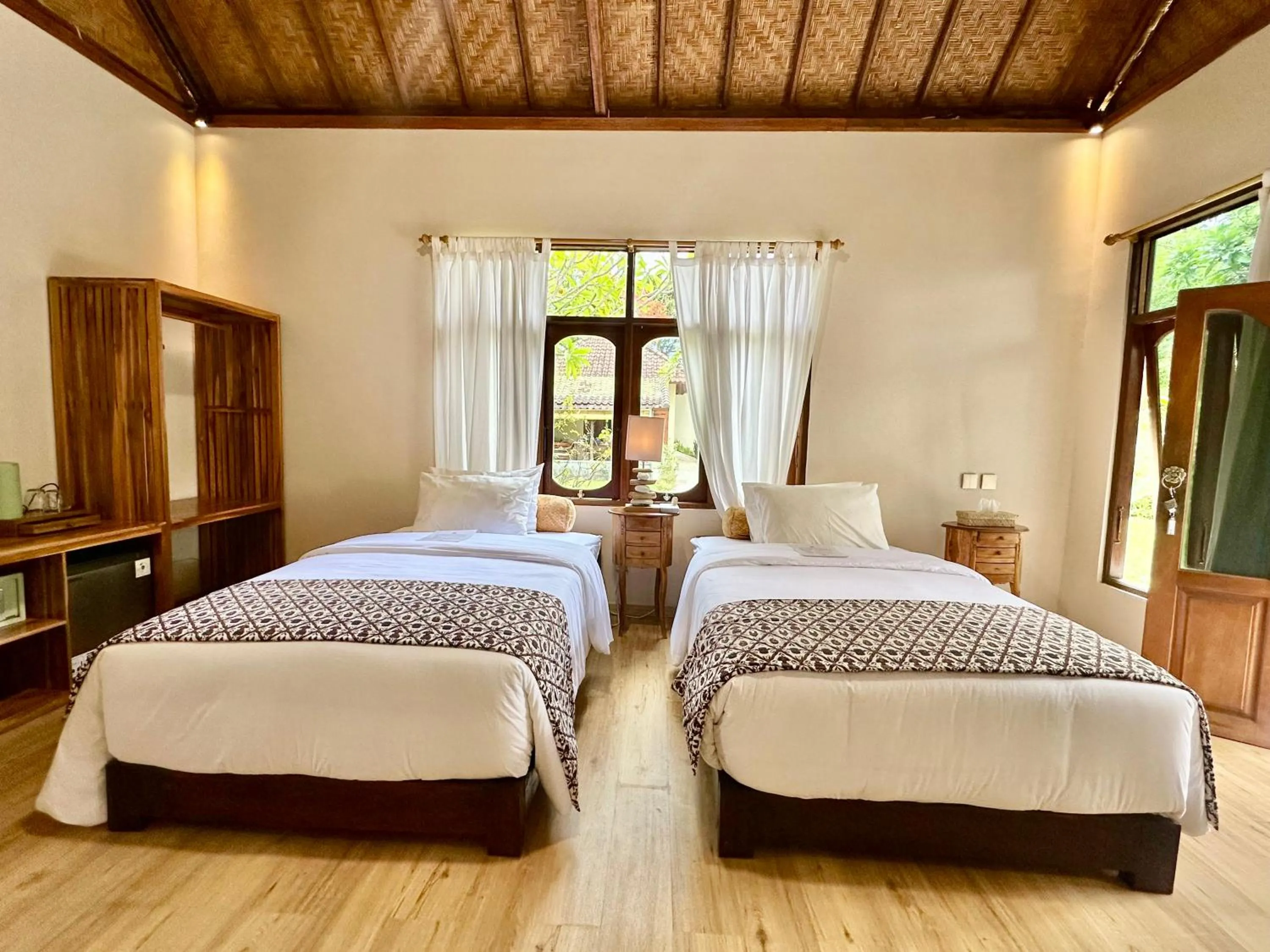 Bed in Aashaya Jasri Resort