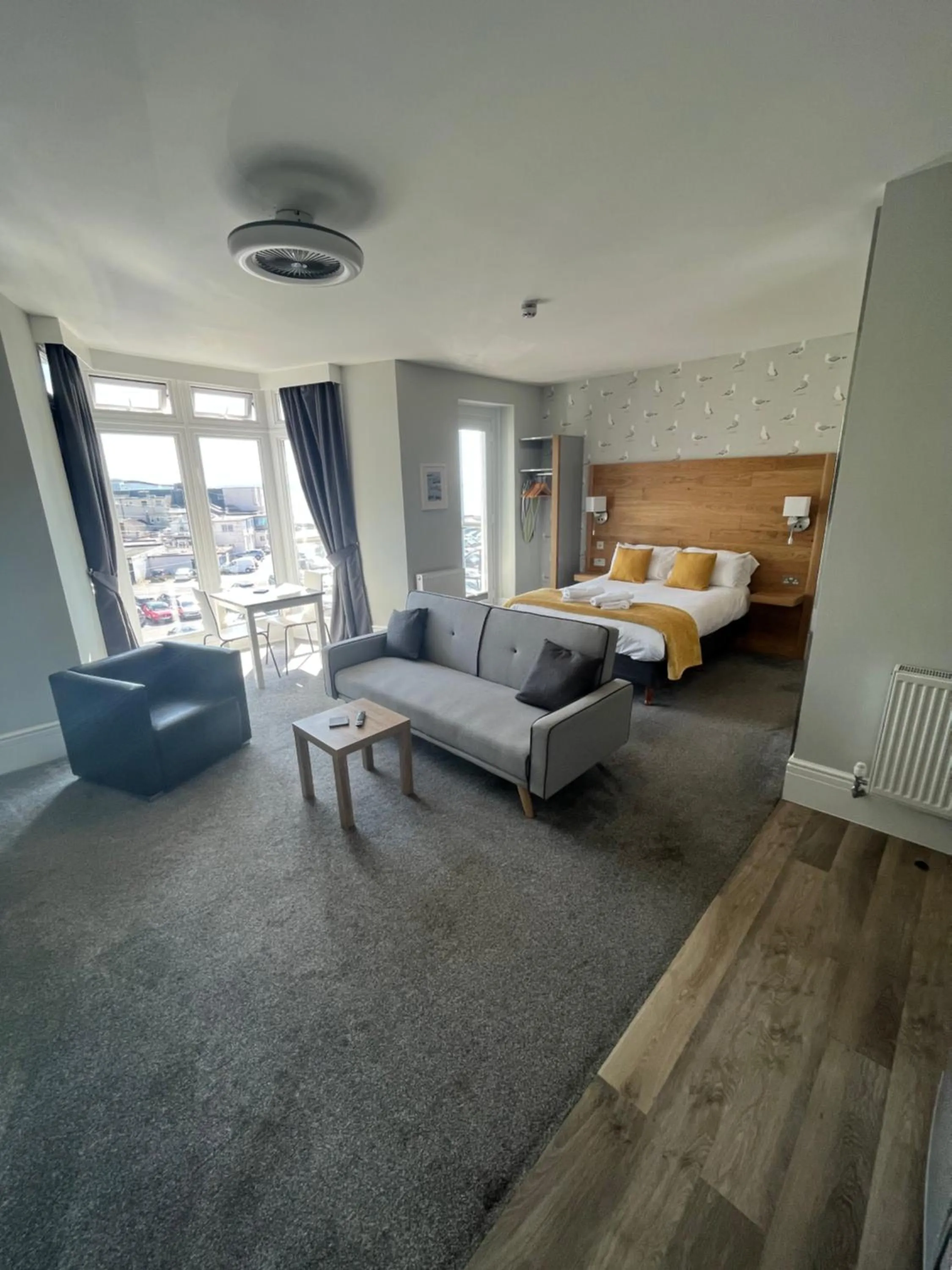 Living room, Bed in Harmony Apartments