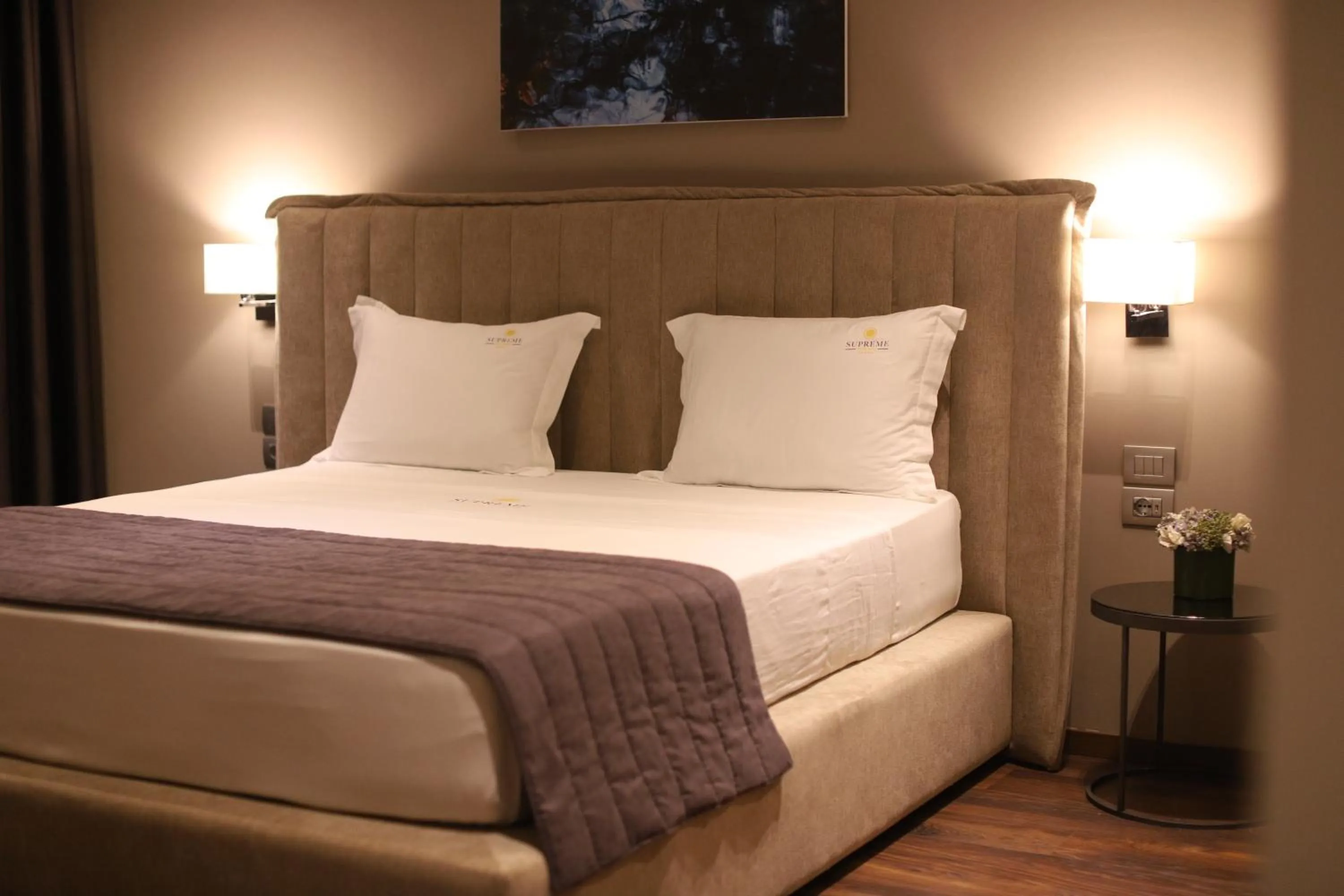 Bed in Supreme Hotel