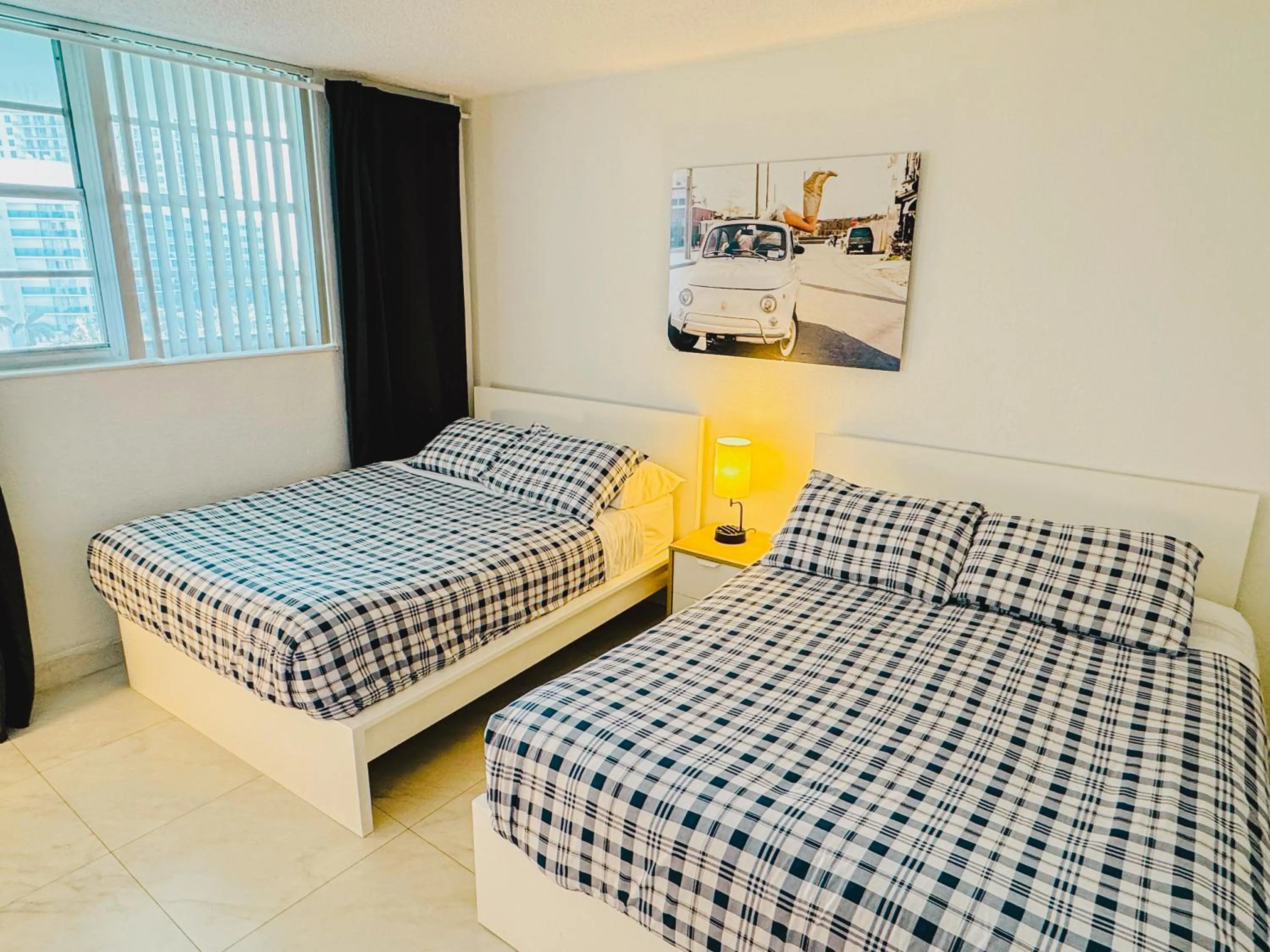 Bed in Hallandale Condo, Partial Ocean View Direct Beach and Pool Access Hollywood Beach