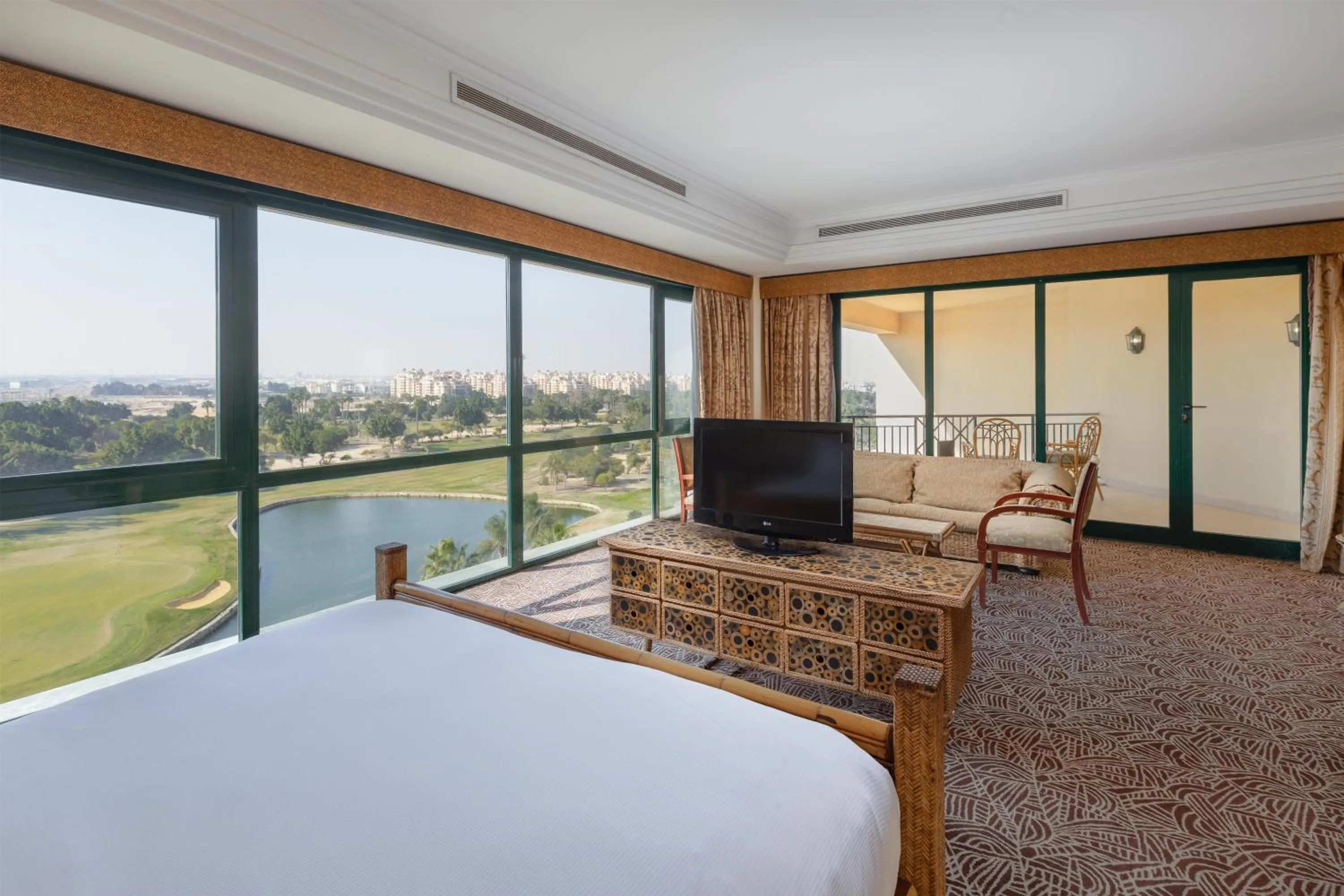 View (from property/room), Bed in Hilton Pyramids Golf