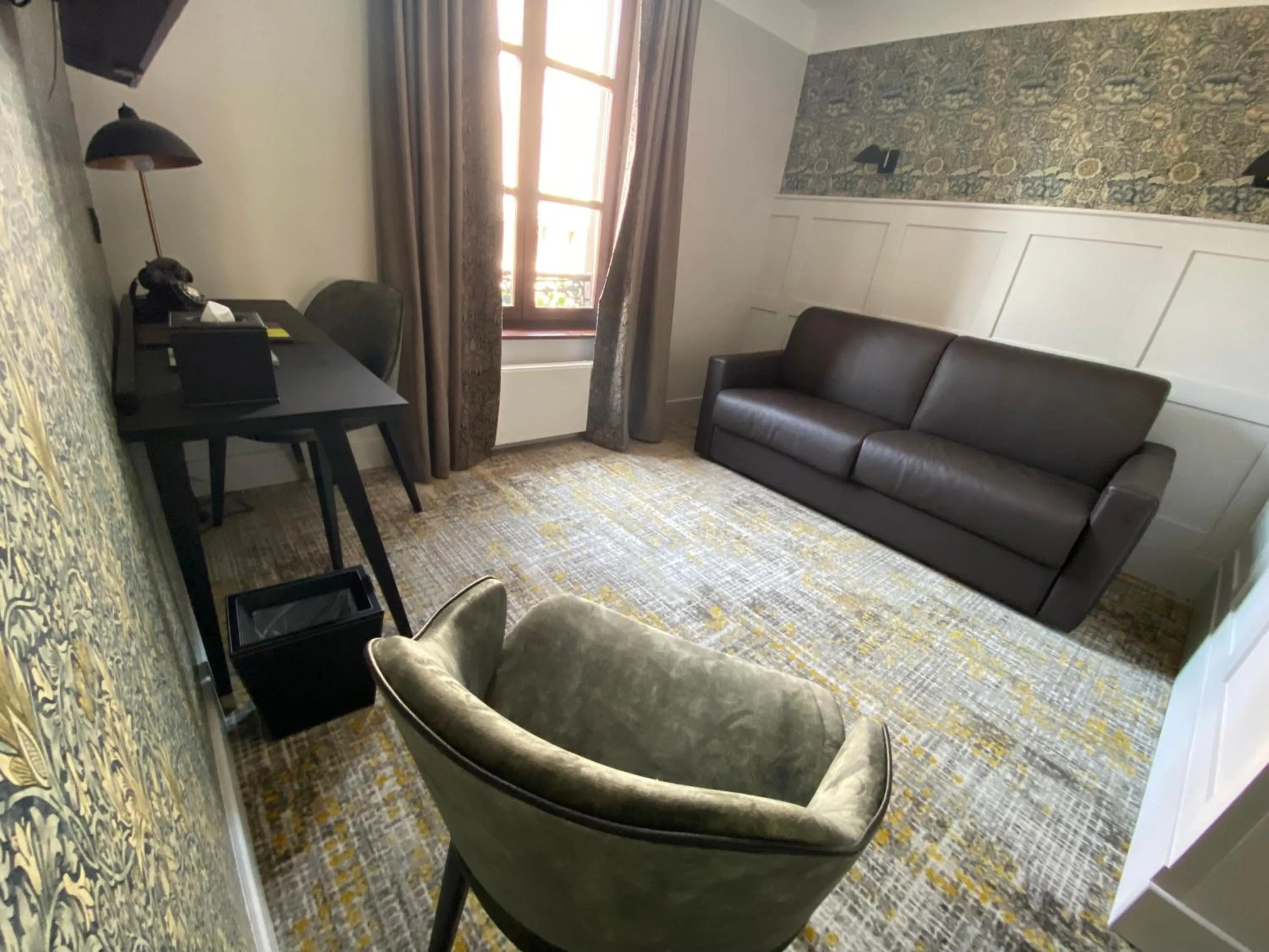 Seating area in Logis Hôtel-Restaurant du Mouton