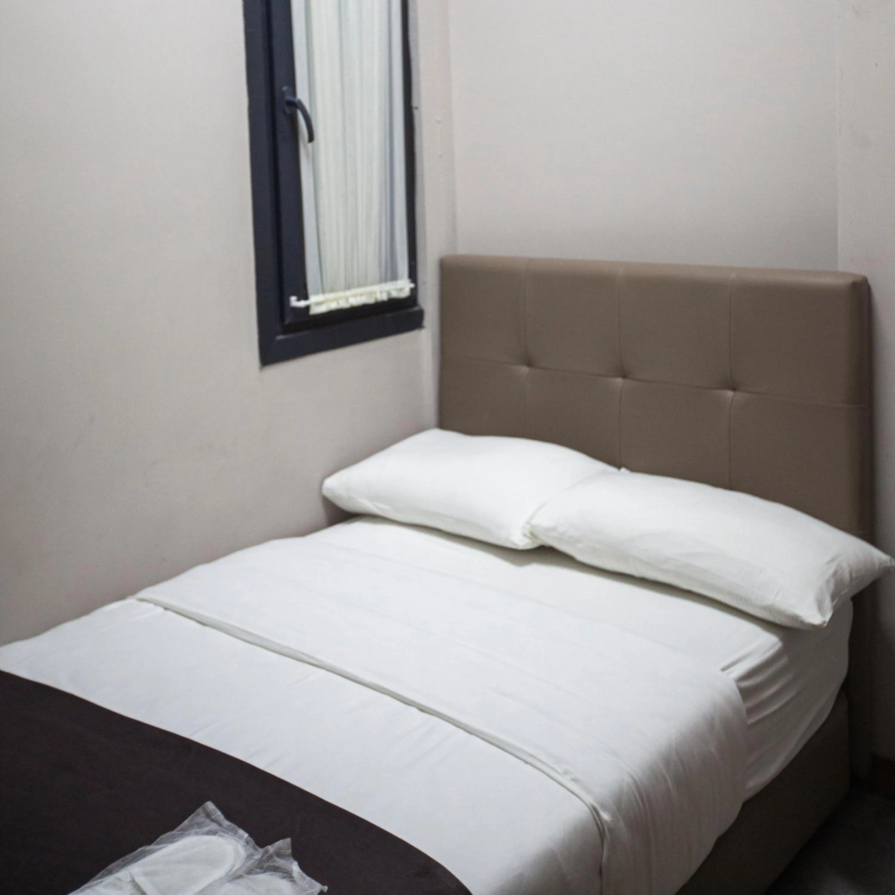 Bed in Jurnal Hotel