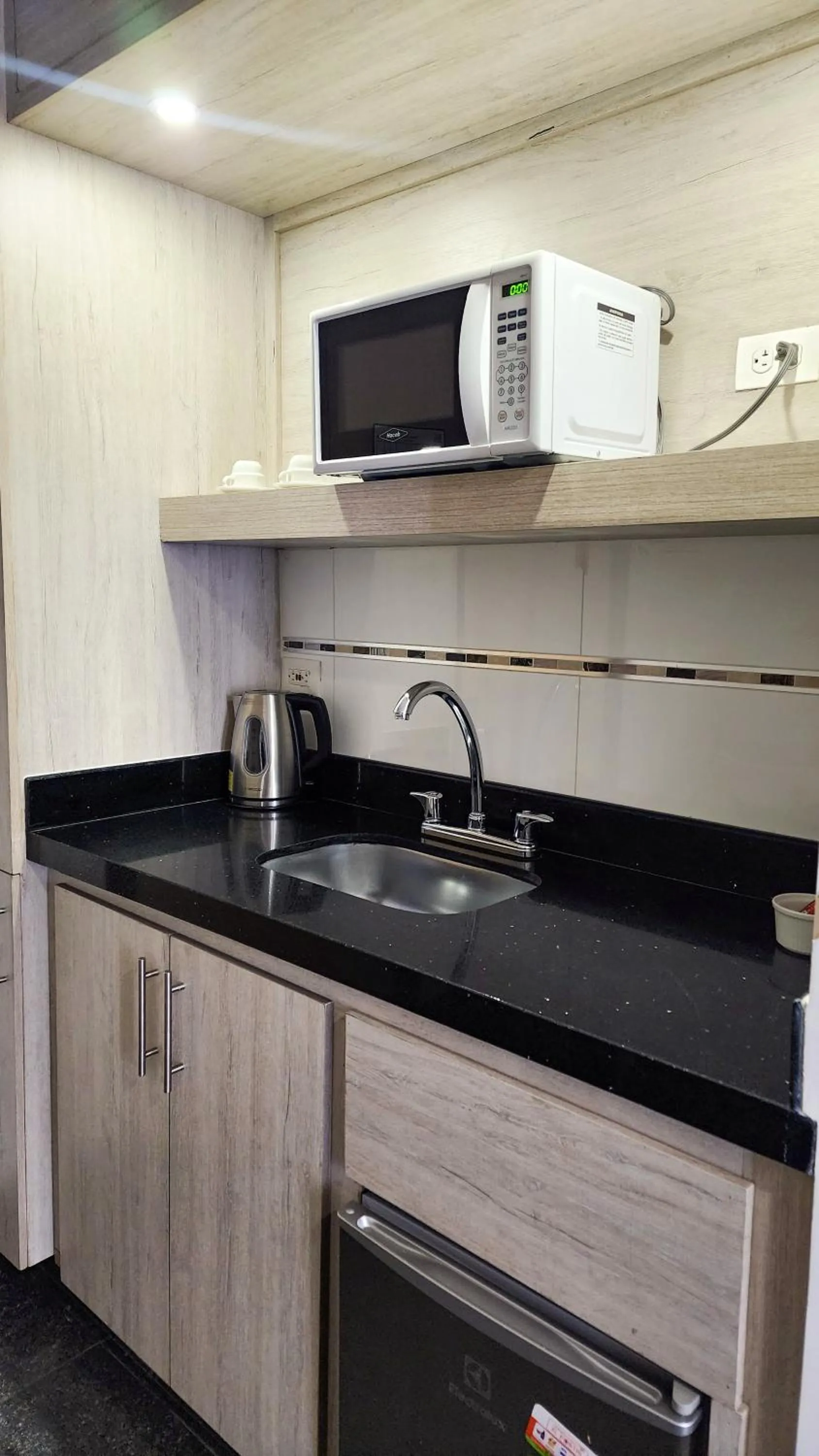 Kitchen or kitchenette in BE Suites Hotel Cali