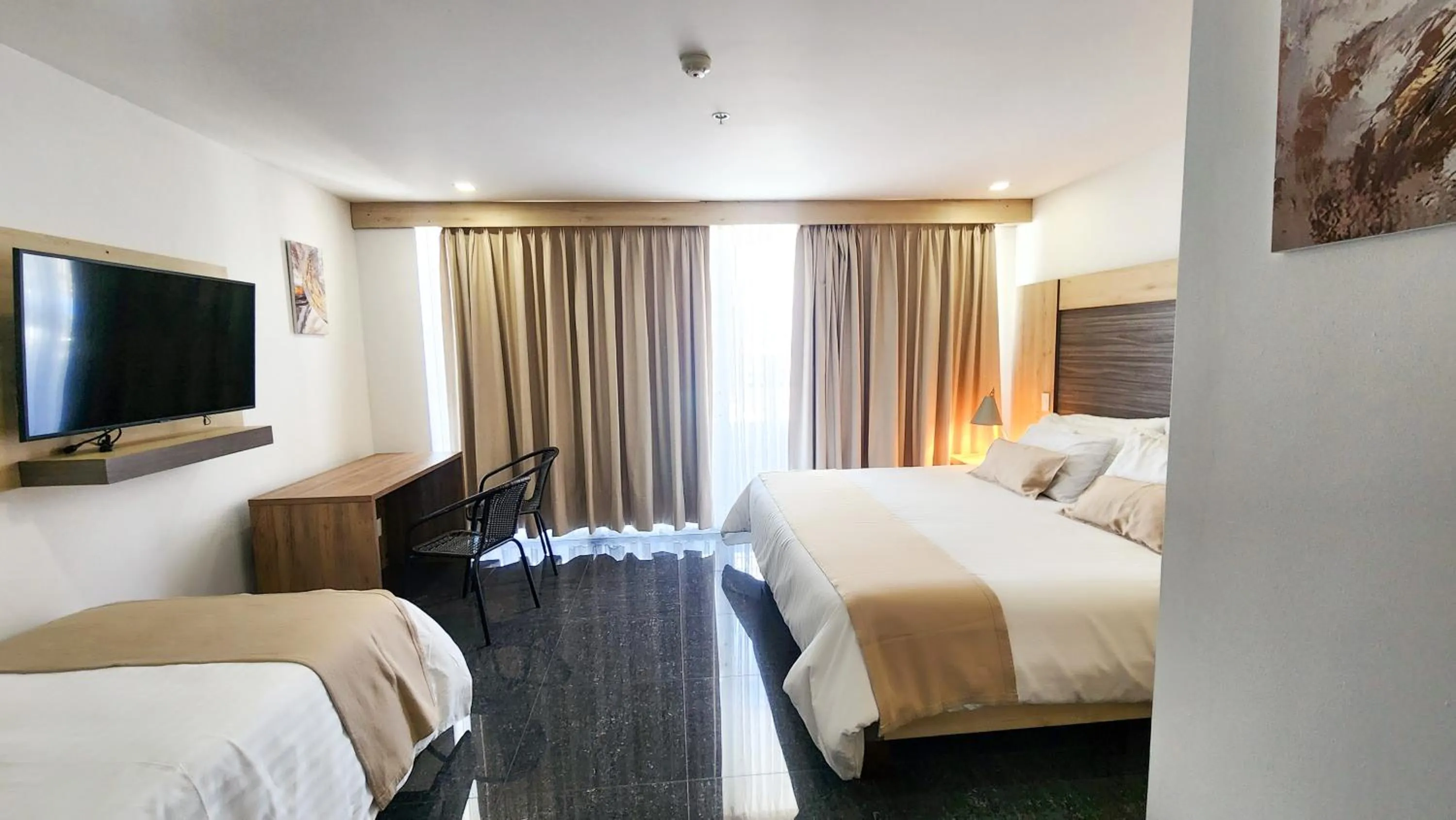 Bed in BE Suites Hotel Cali