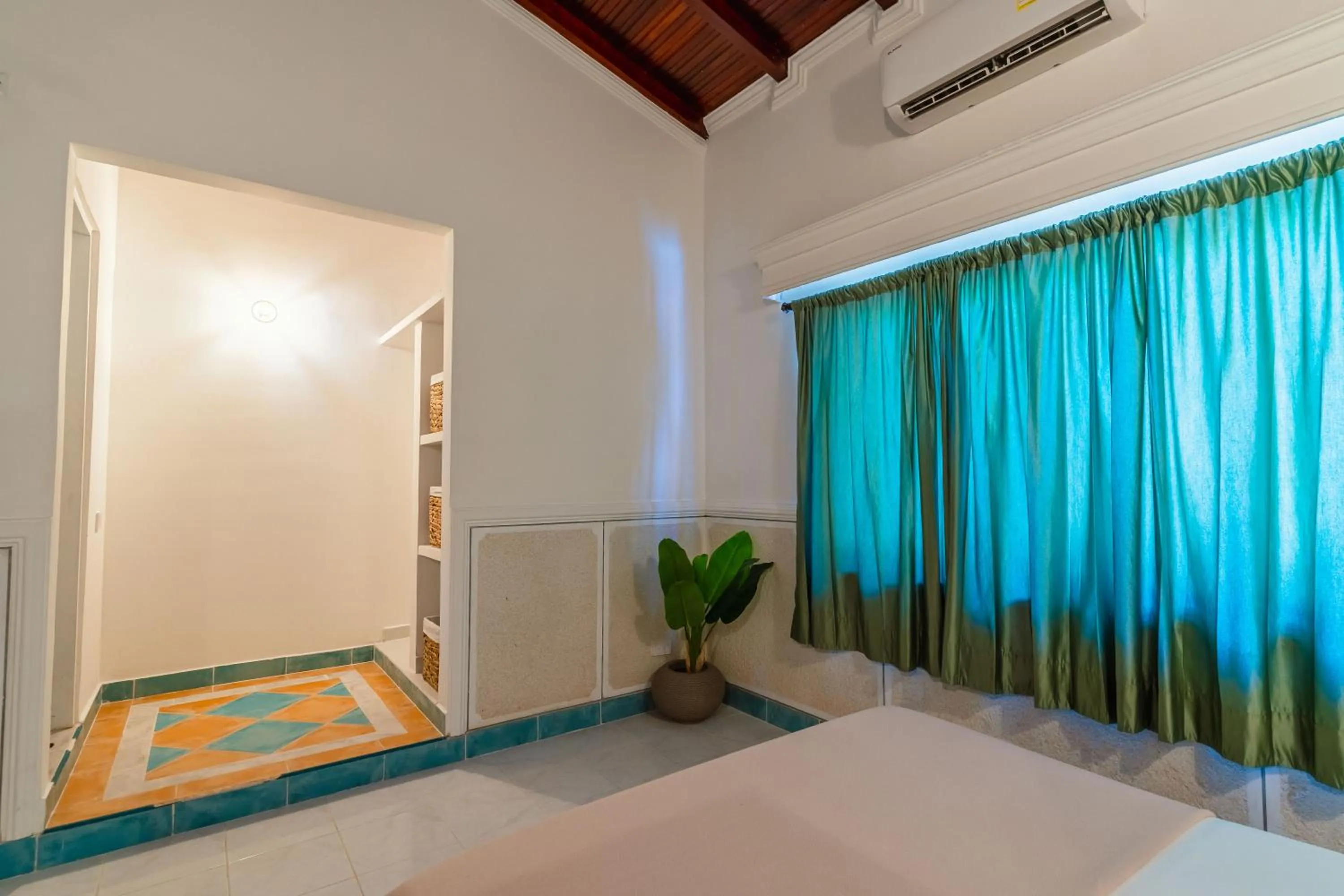 air conditioner, Bed in Hotel Cocoliso Island Resort