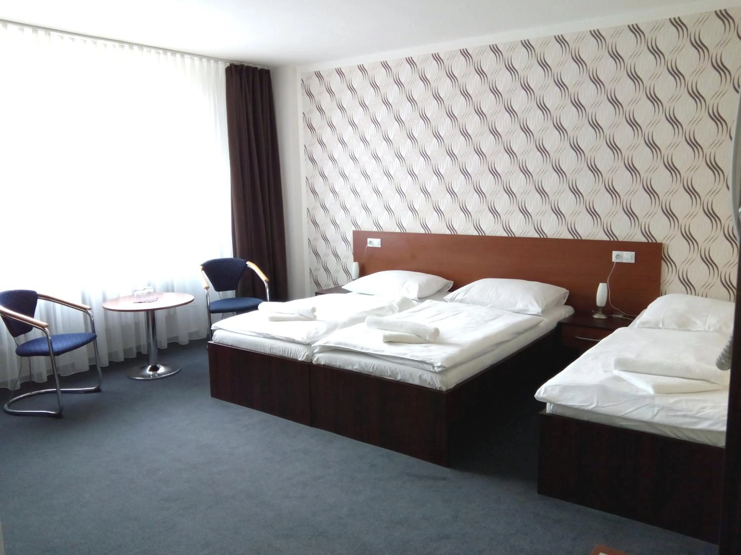 Bed in Hotel Arkáda