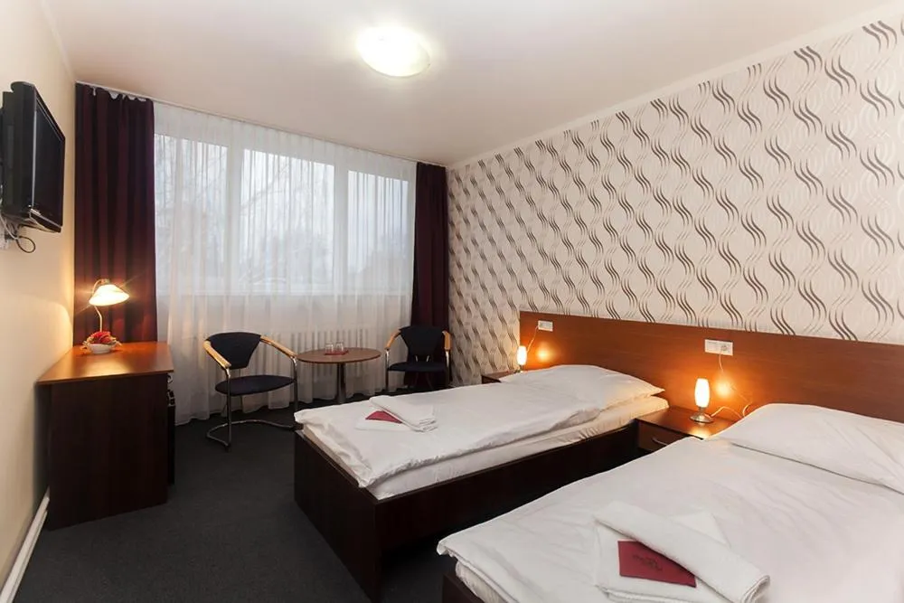 Bed in Hotel Arkáda