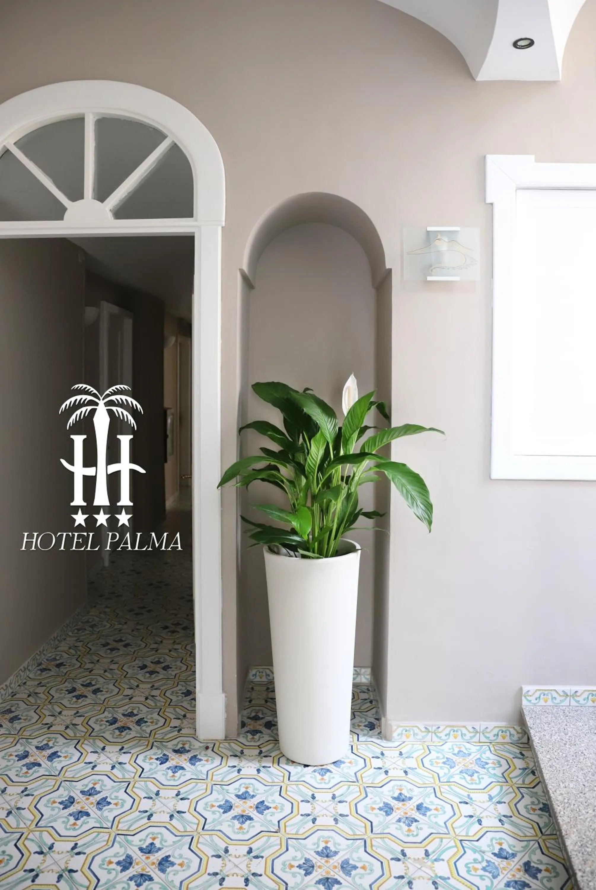 Property logo or sign in Hotel Palma