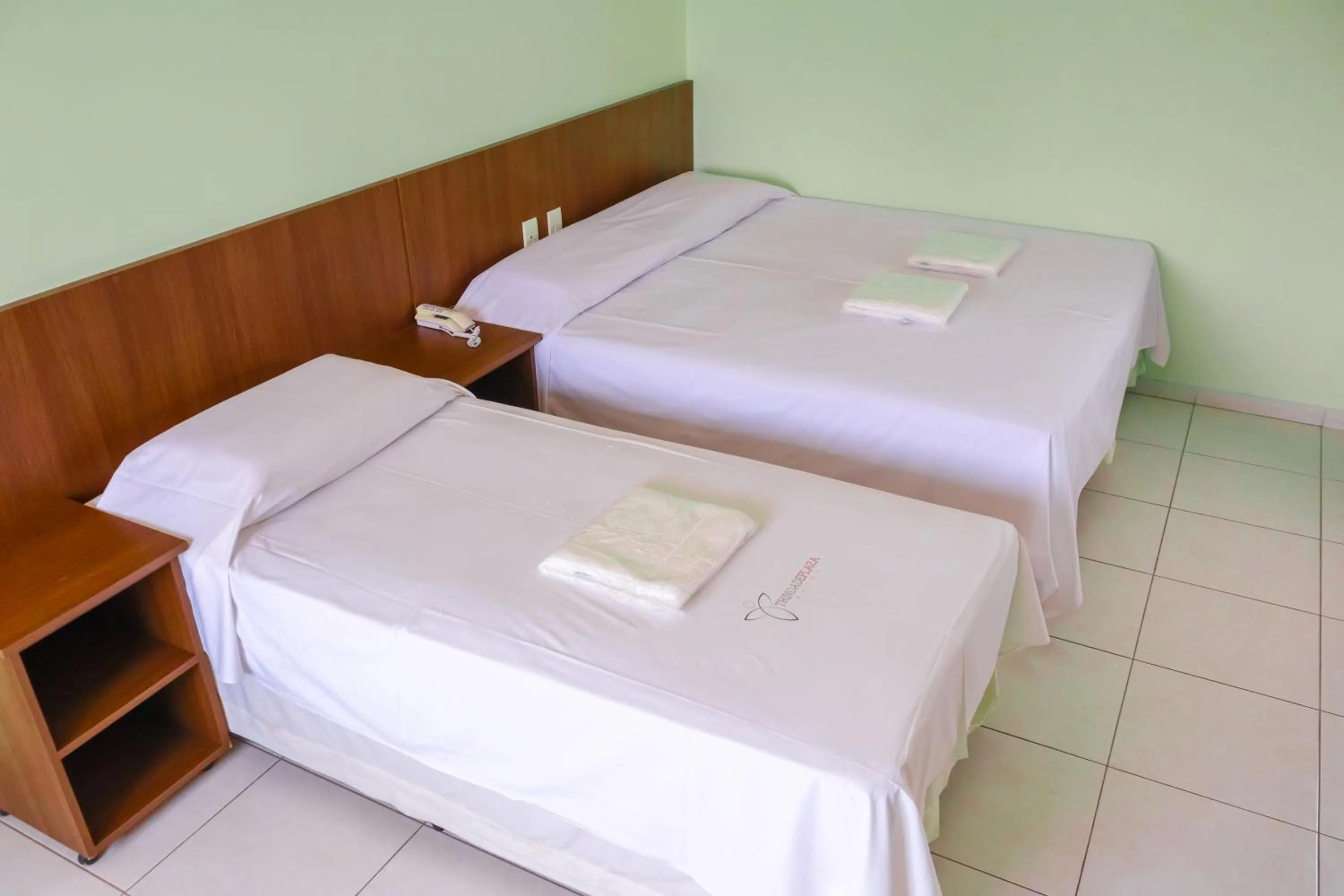 Bed in Trindade Plaza Hotel