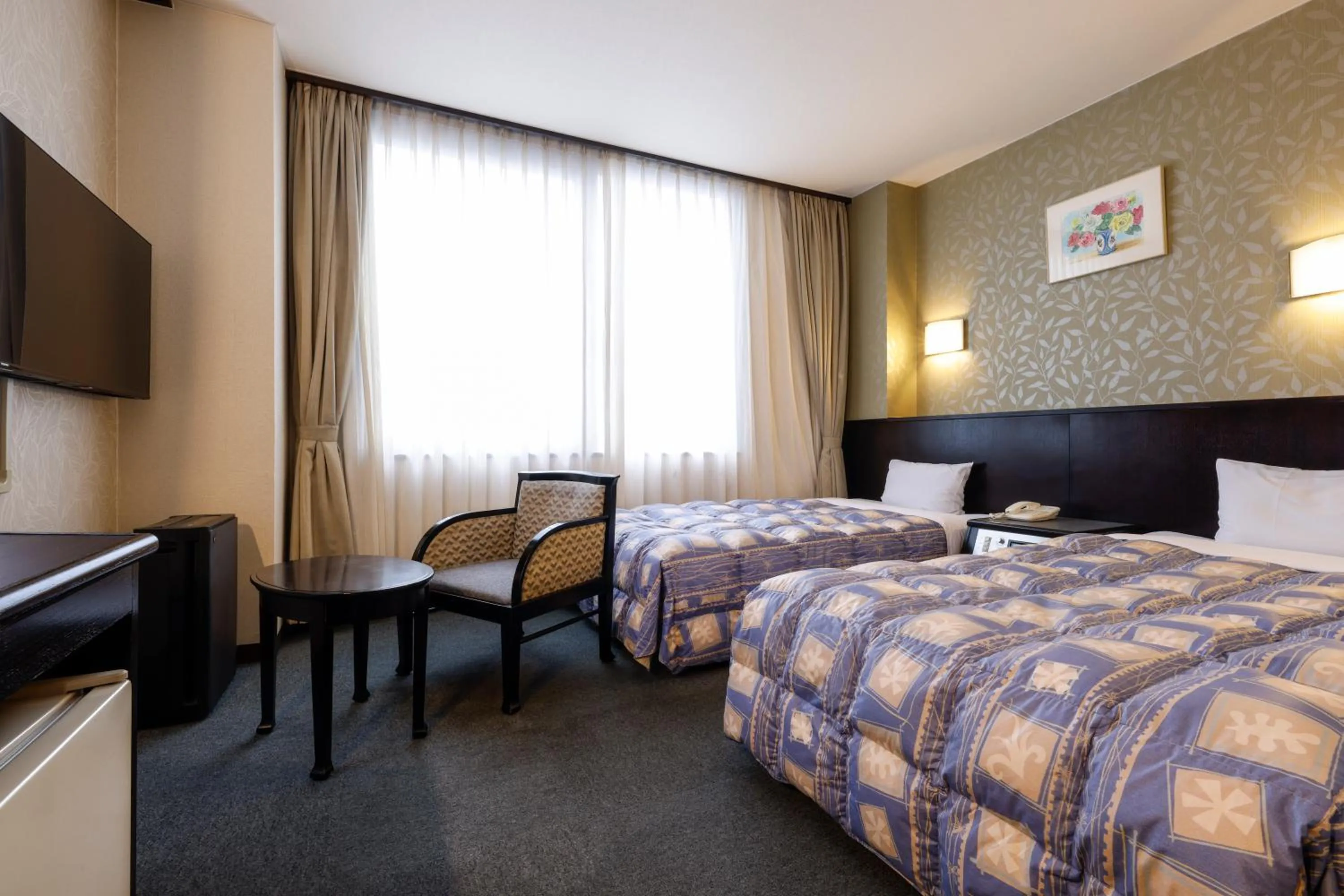 Bed in Kotohira Riverside Hotel