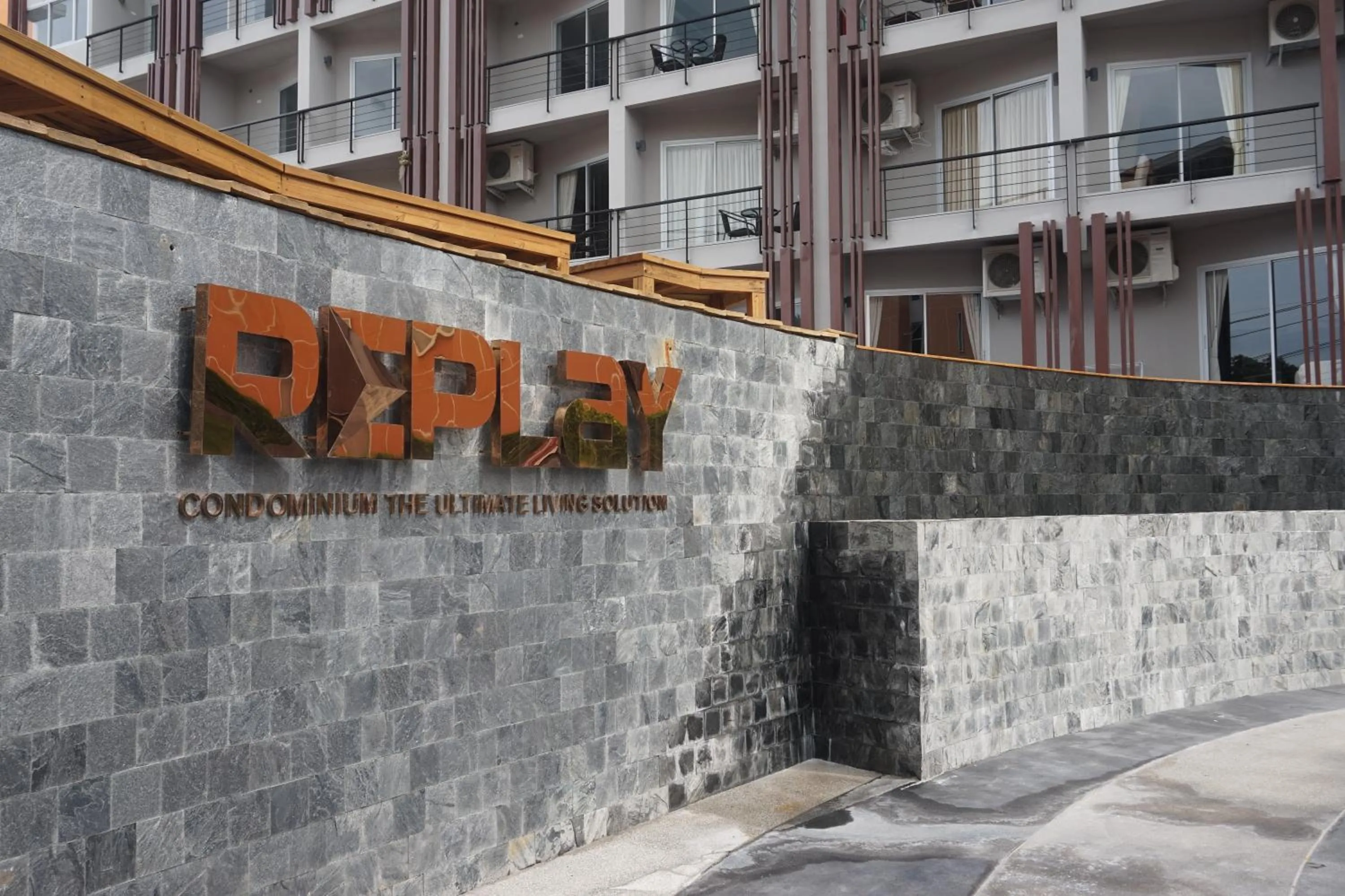 Property logo or sign in Replay Residences Samui