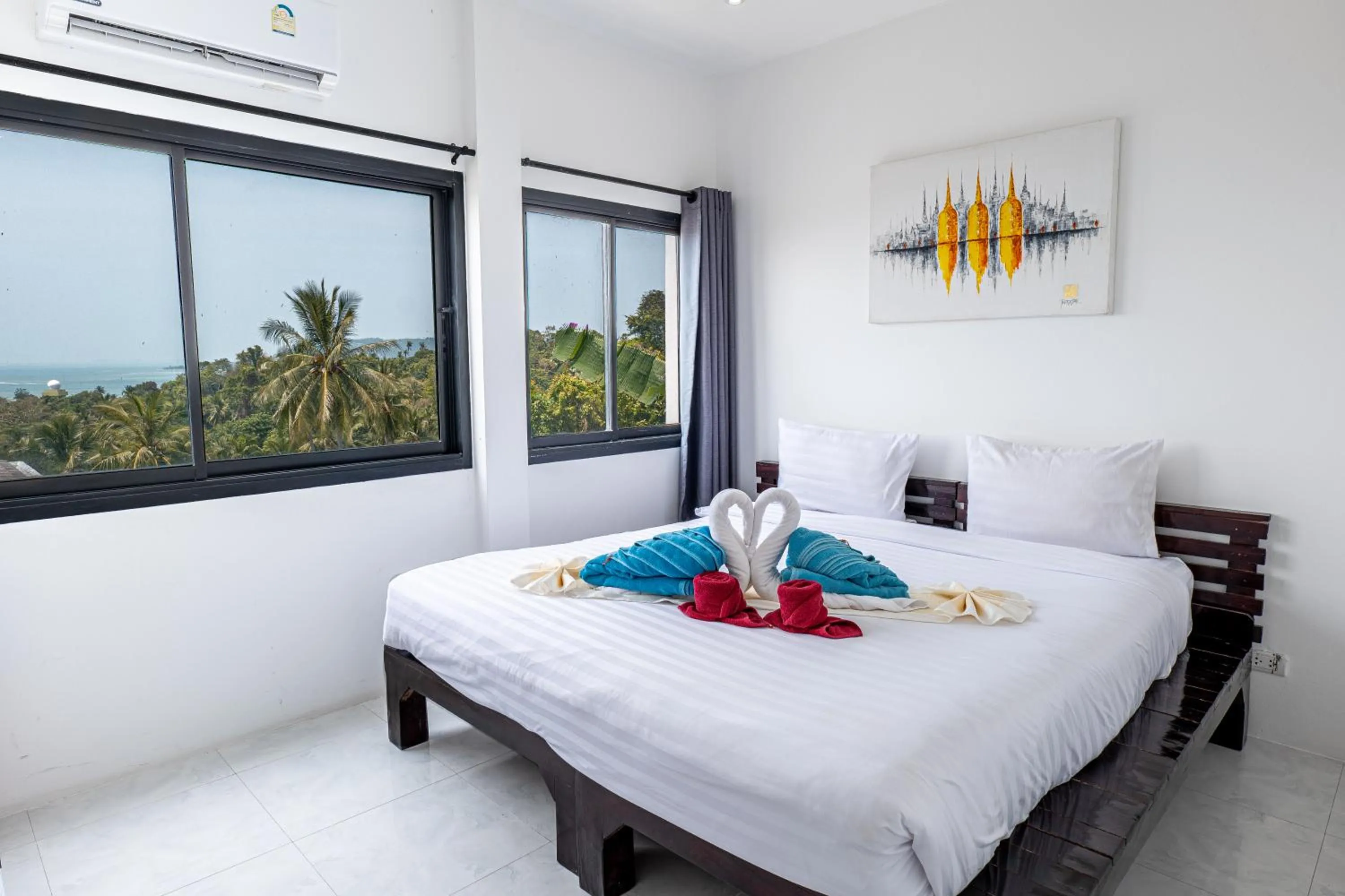 Bed in Tropical Sea View Residence