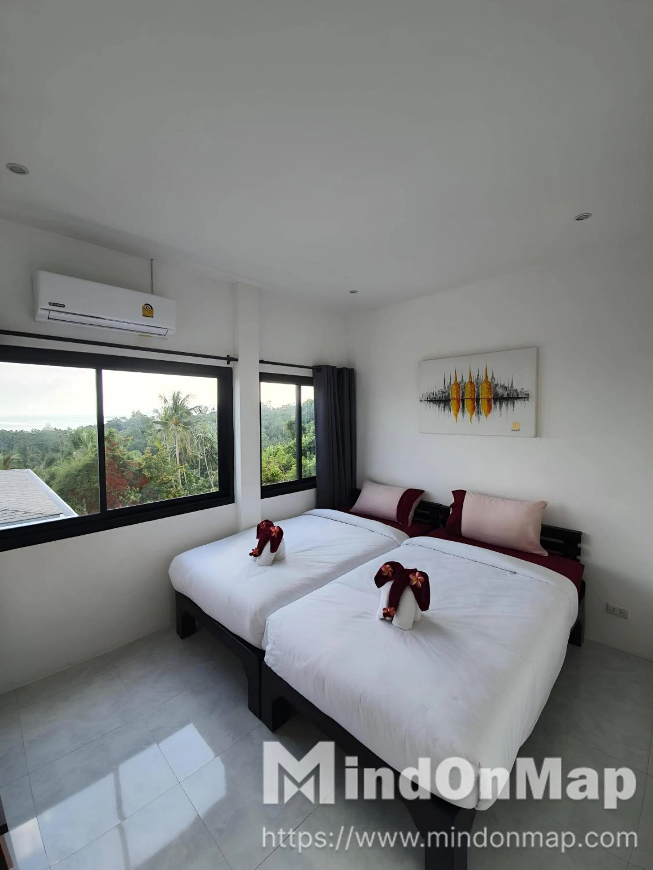 Bed in Tropical Sea View Residence