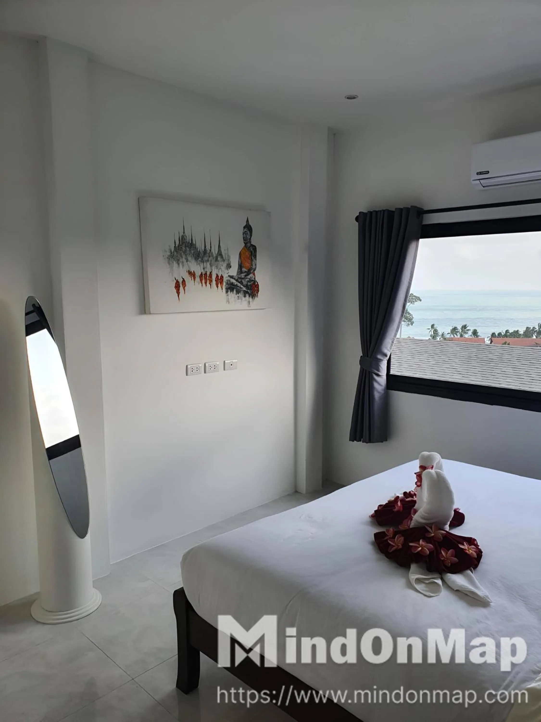 Bed in Tropical Sea View Residence