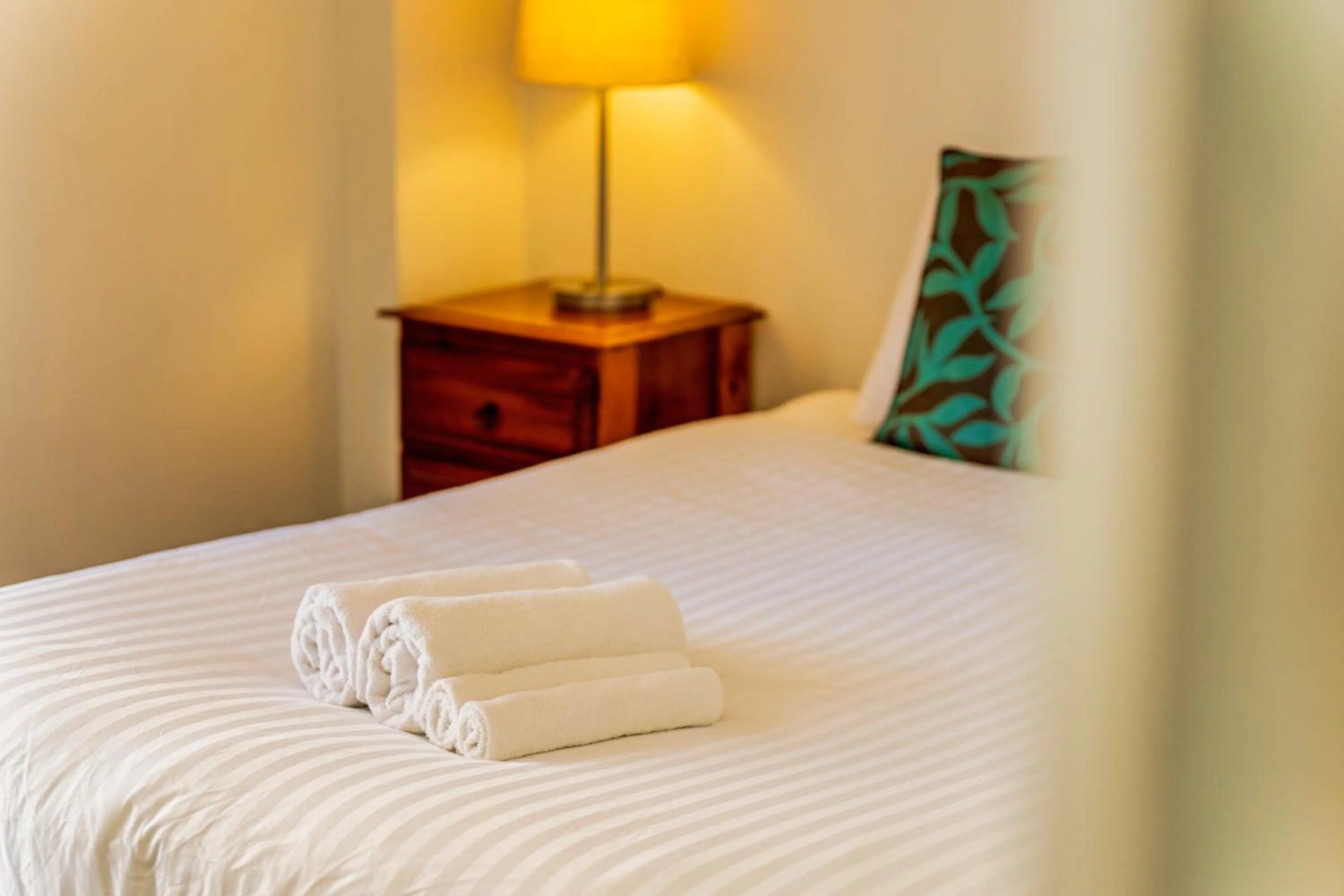 Bedroom, Bed in Olympus Beachfront Apartments