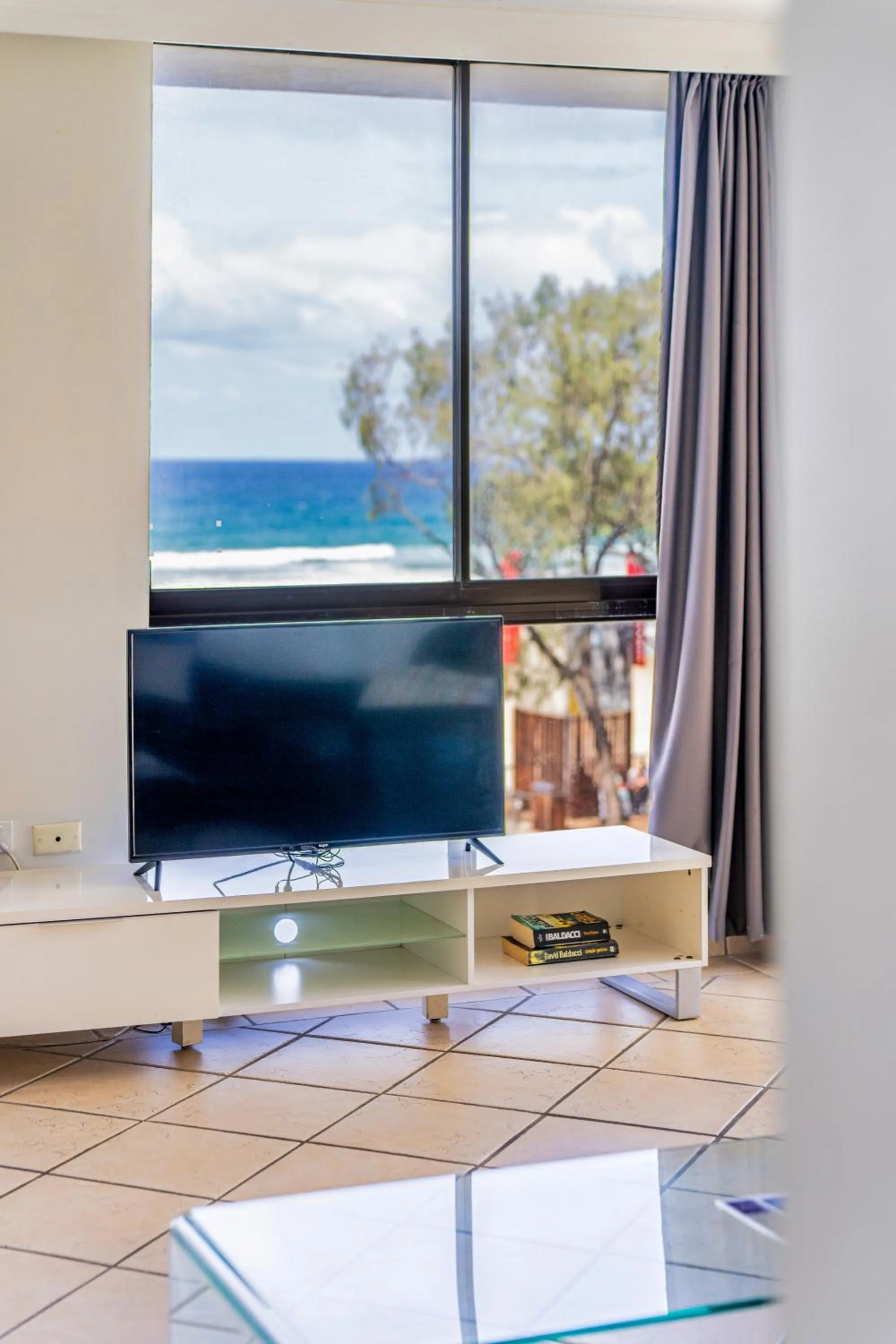 Living room in Olympus Beachfront Apartments