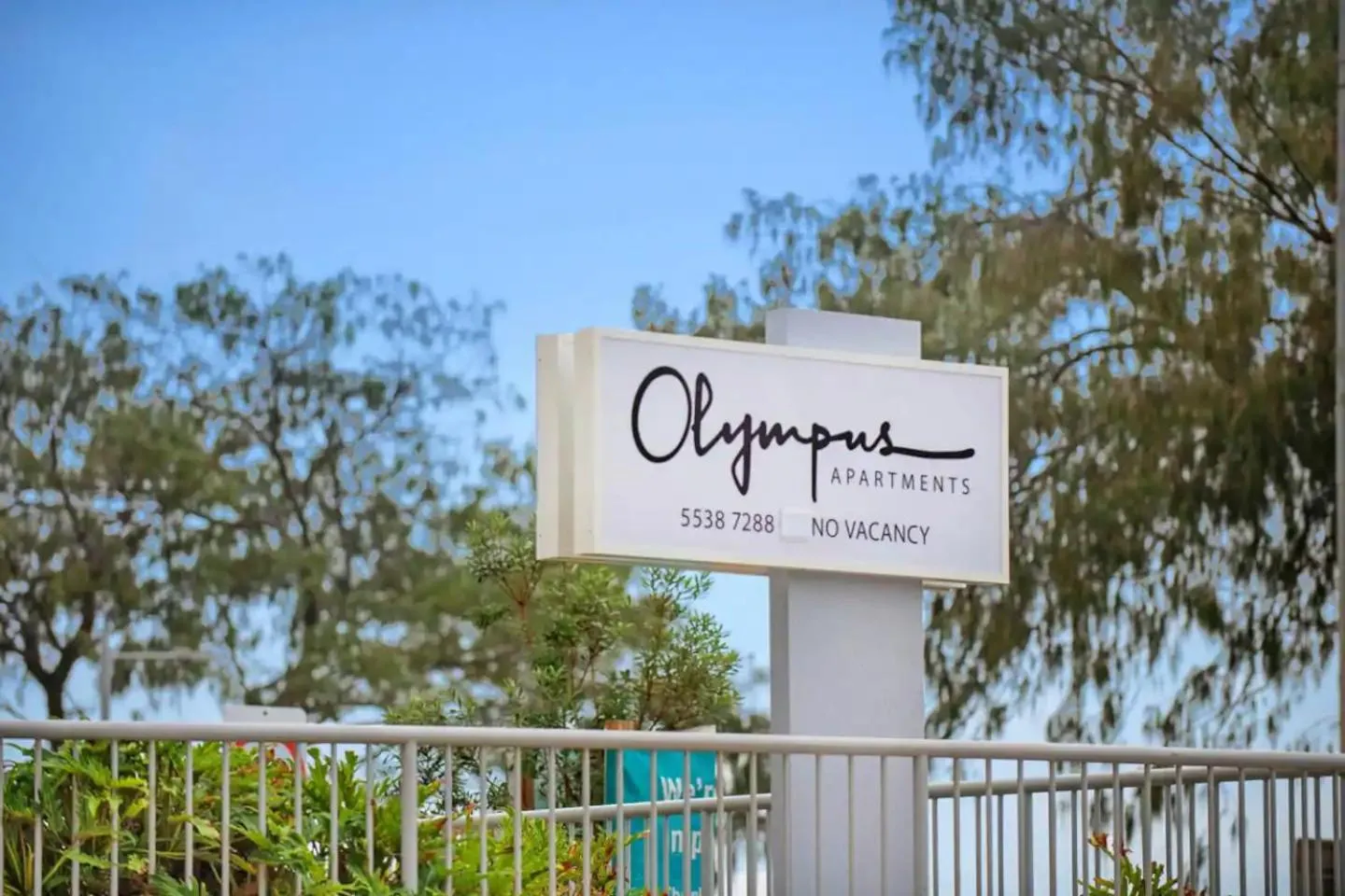 Property logo or sign in Olympus Beachfront Apartments