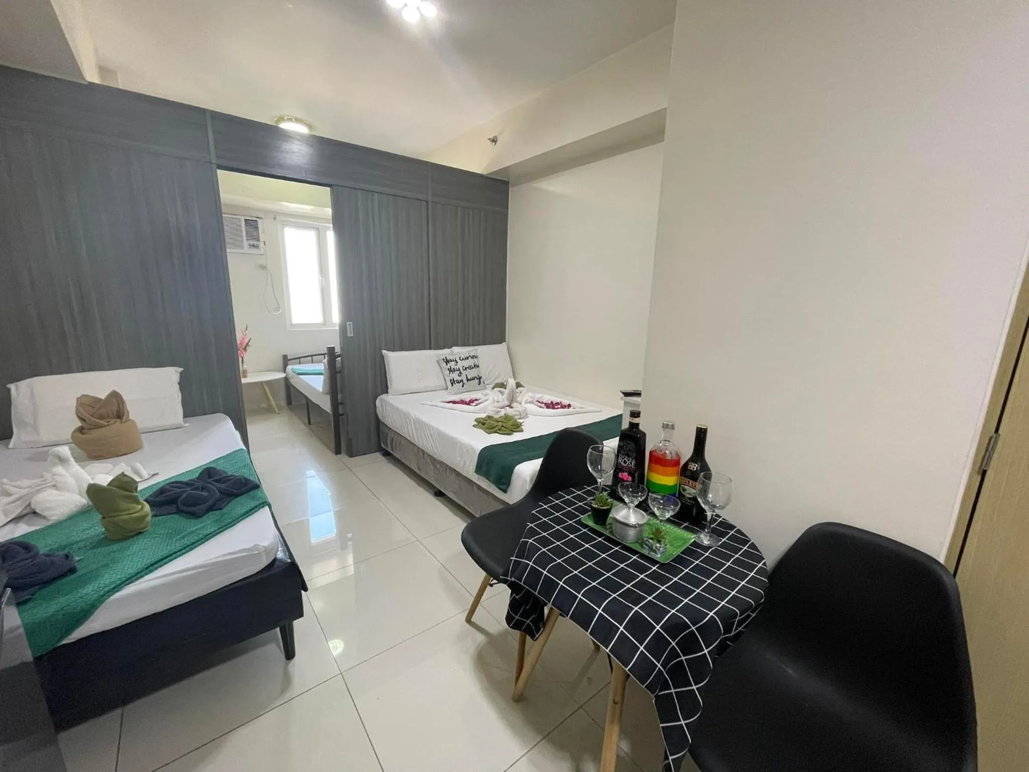 Bed in Green Residences Stays by PBYY