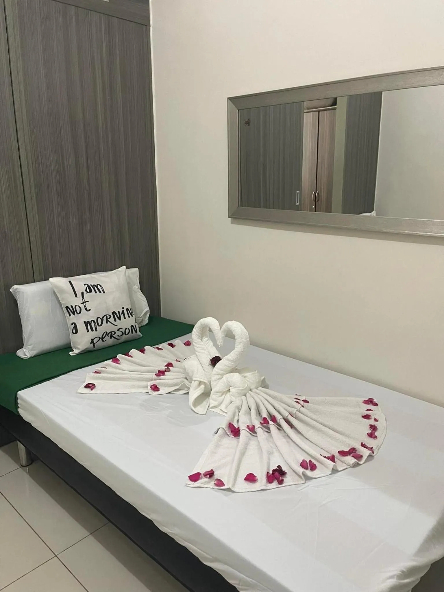 Bed in Green Residences Stays by PBYY