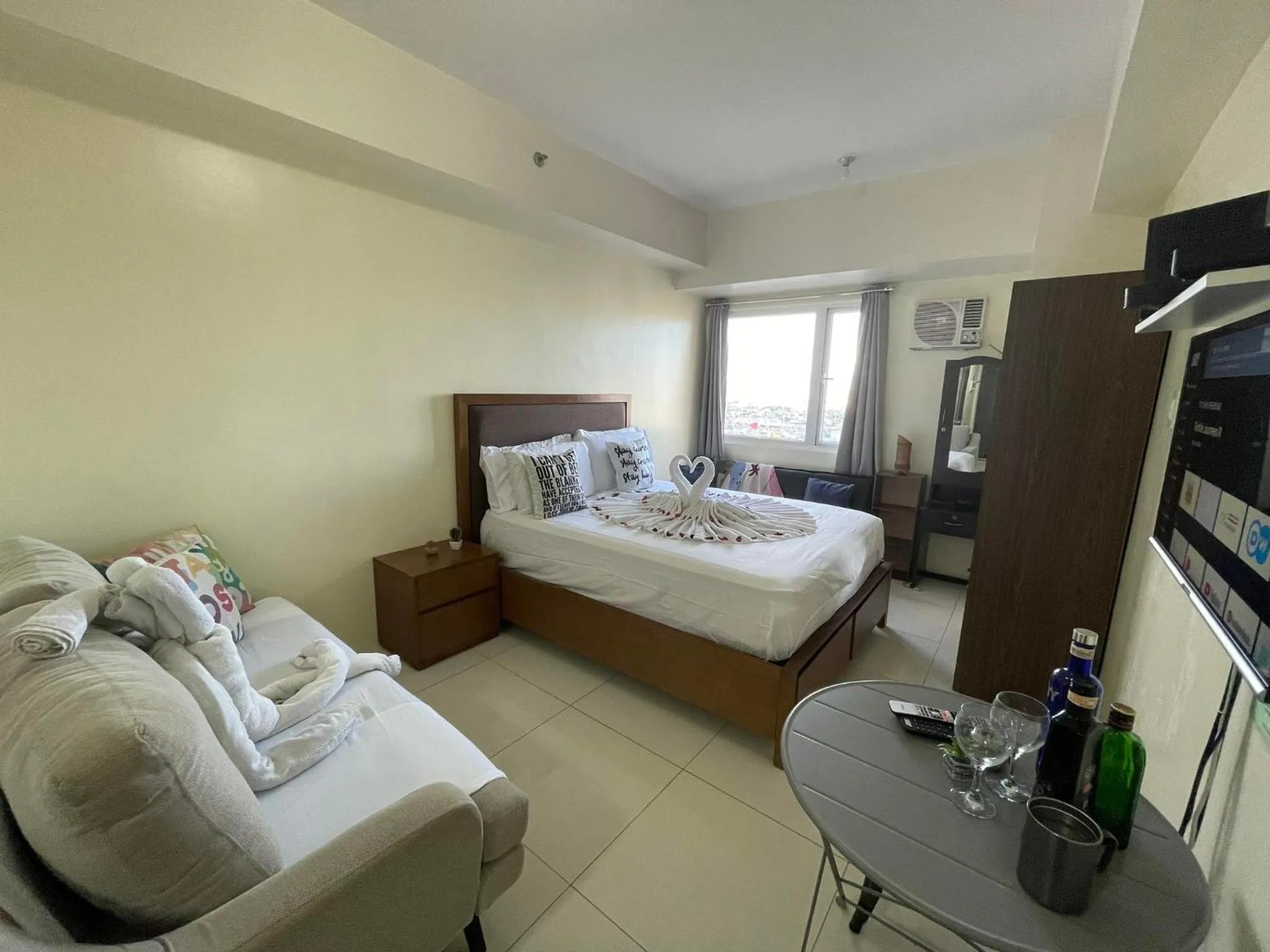 Bed in Green Residences Stays by PBYY