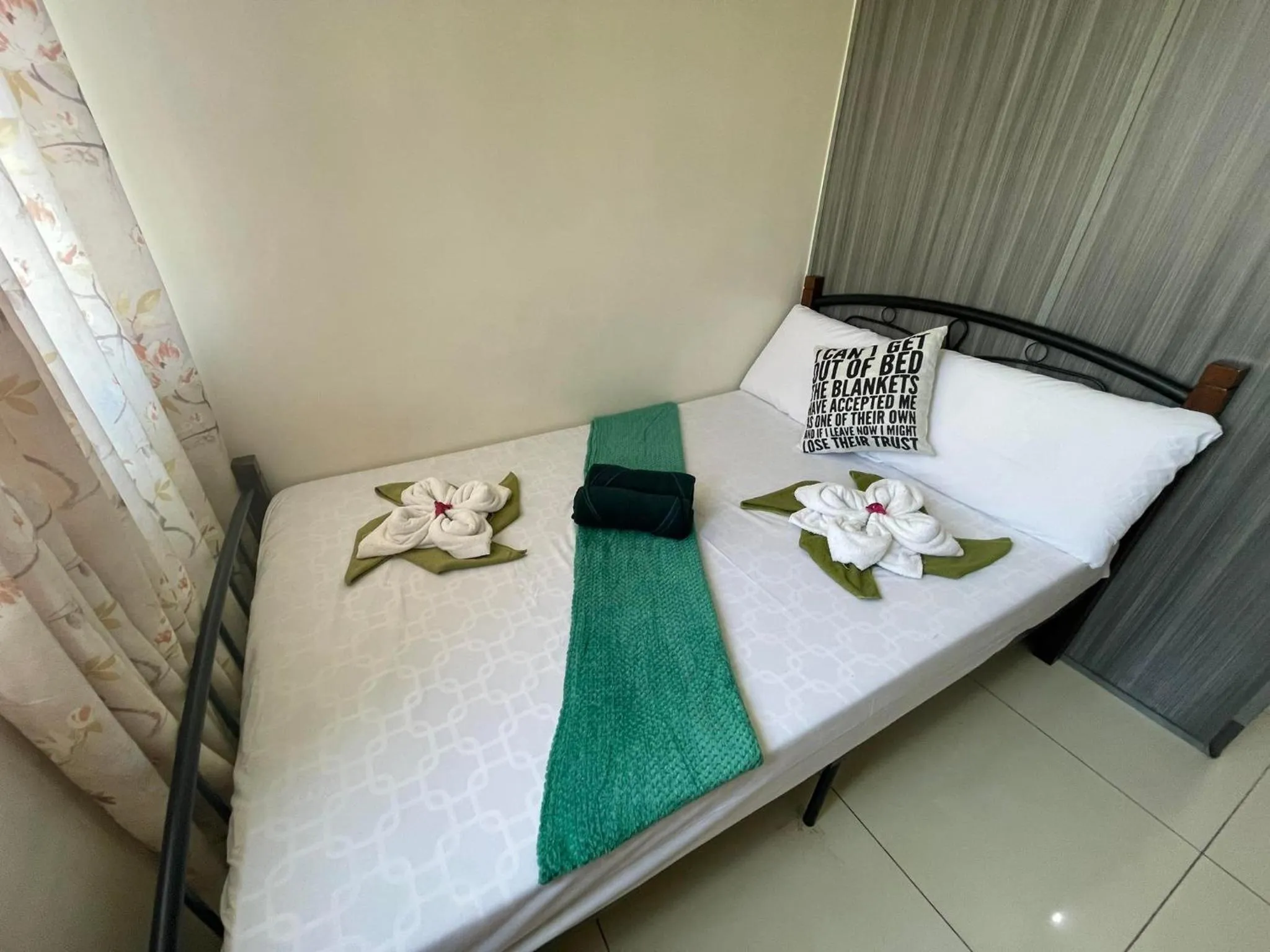 Bed in Green Residences Stays by PBYY