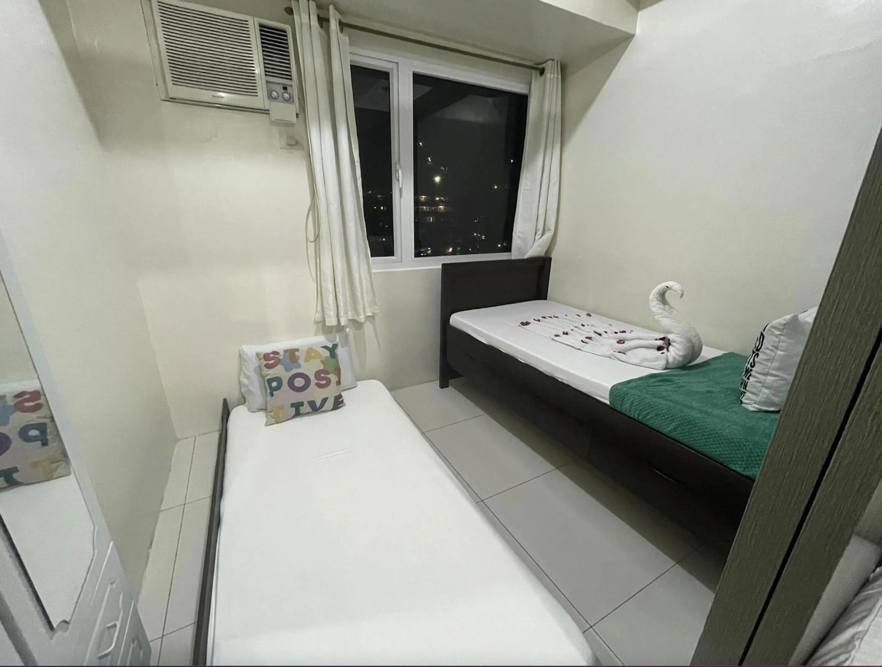 Bed in Green Residences Stays by PBYY