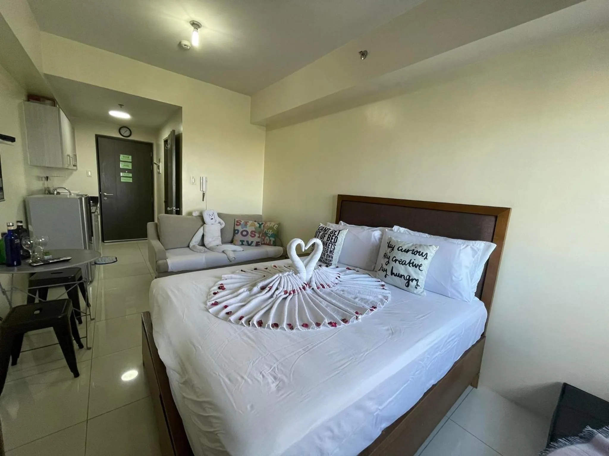 Bed in Green Residences Stays by PBYY