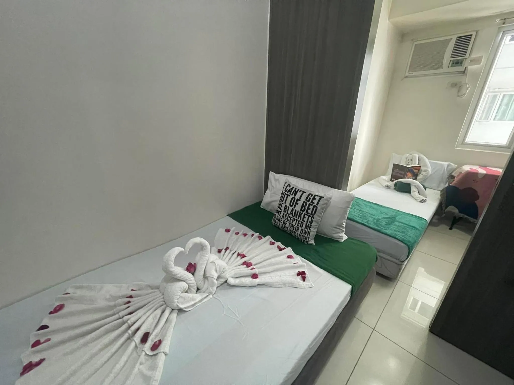 Bed in Green Residences Stays by PBYY