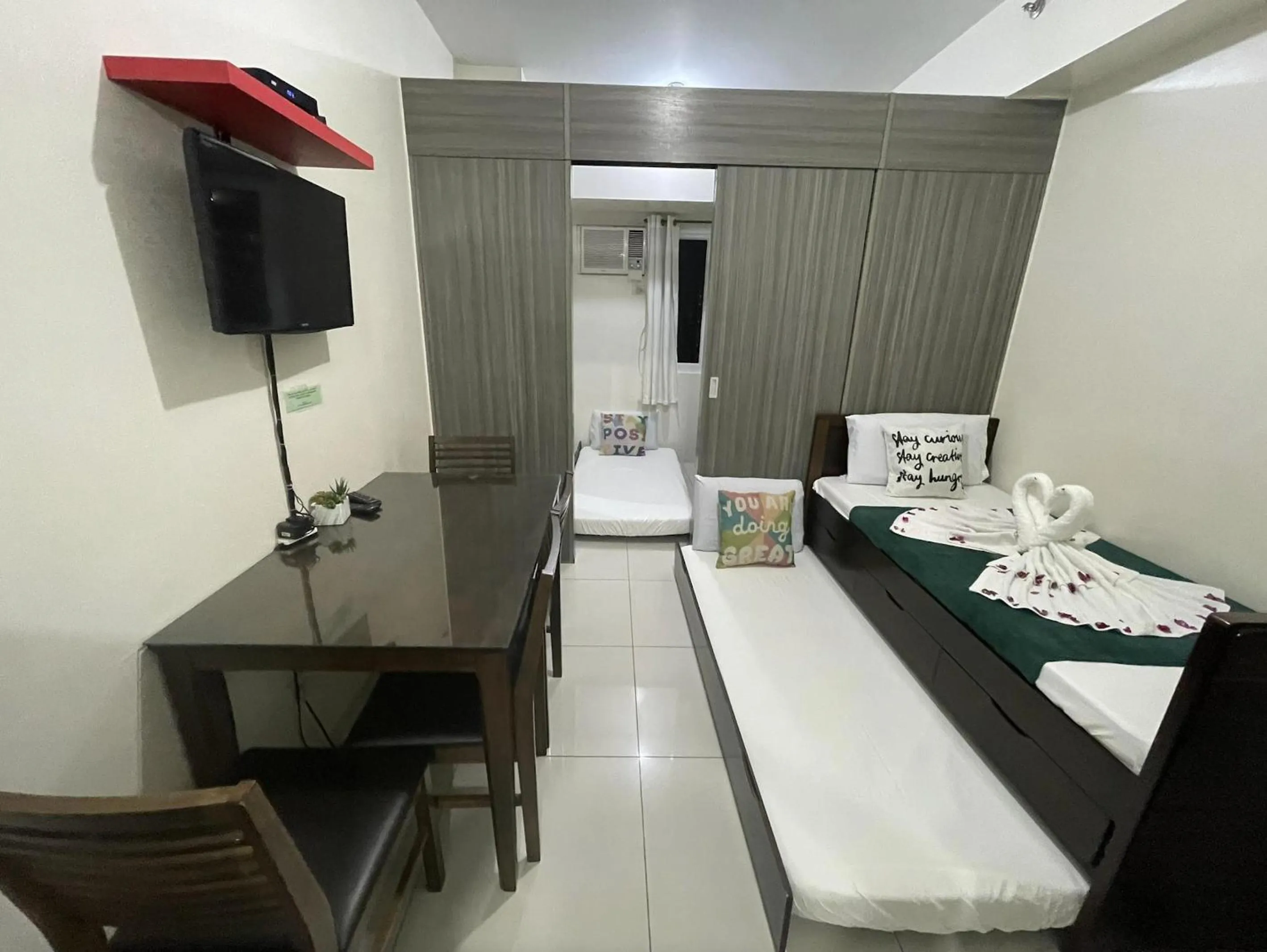 Bed in Green Residences Stays by PBYY