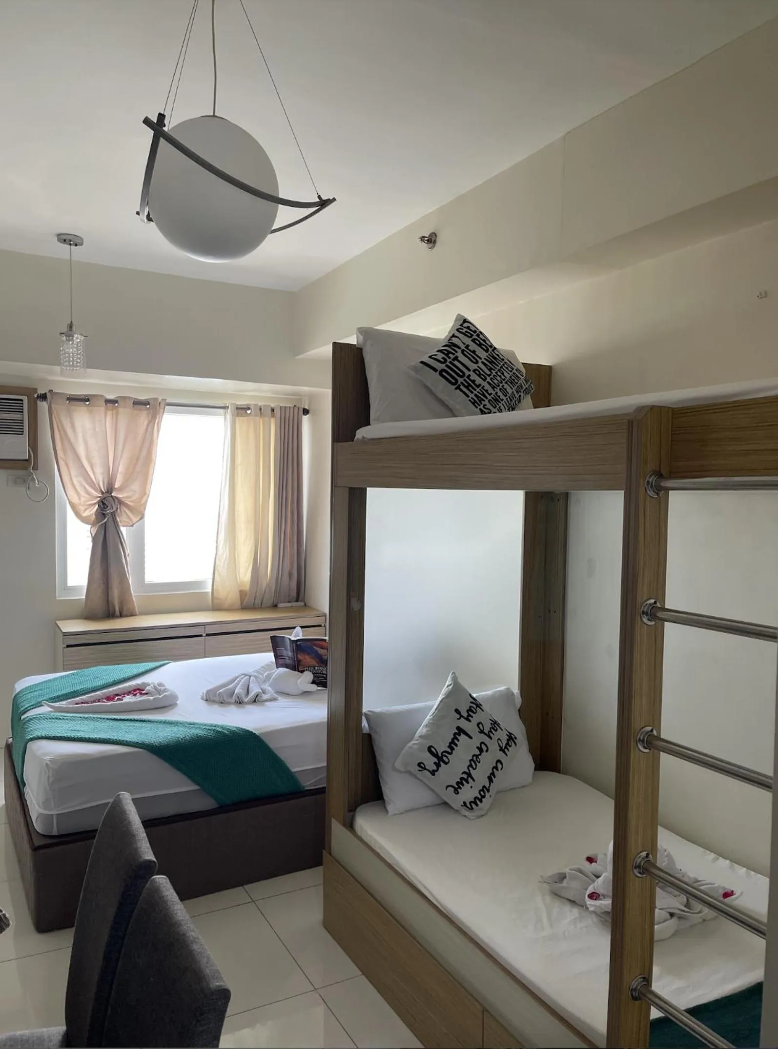 Bed in Green Residences Stays by PBYY