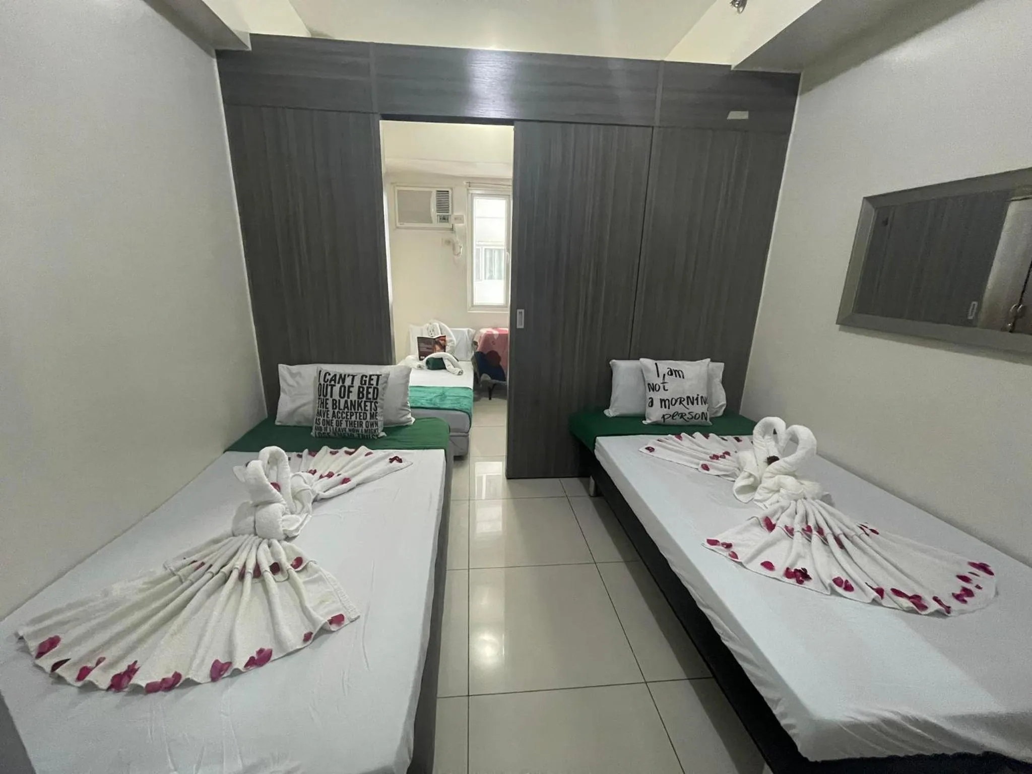 Bed in Green Residences Stays by PBYY