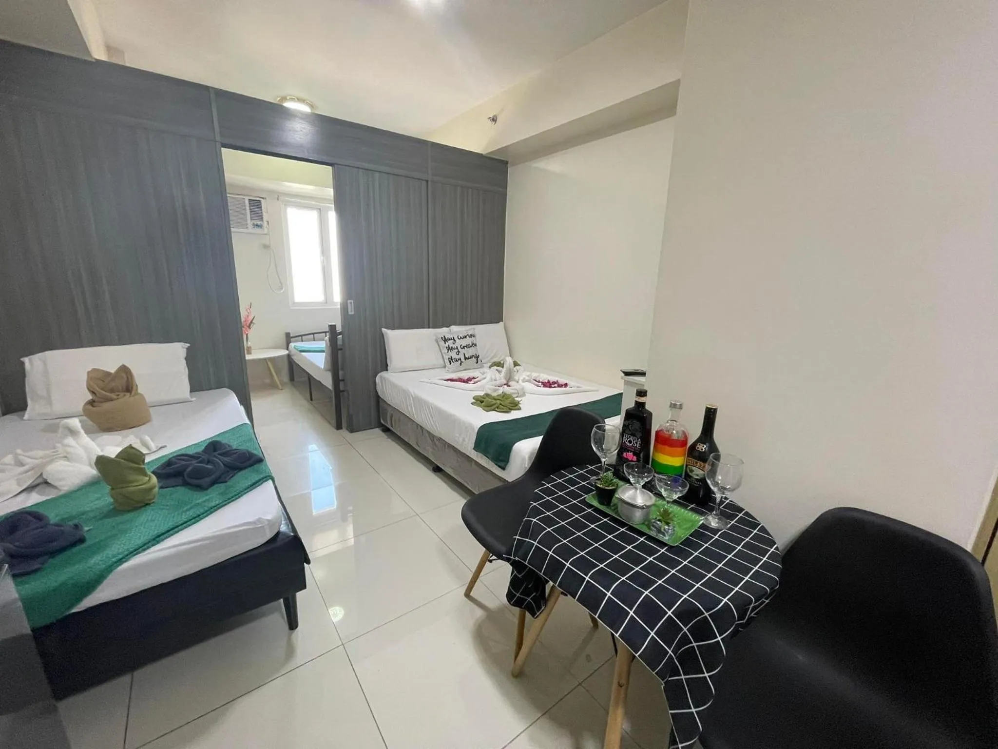 Bed in Green Residences Stays by PBYY