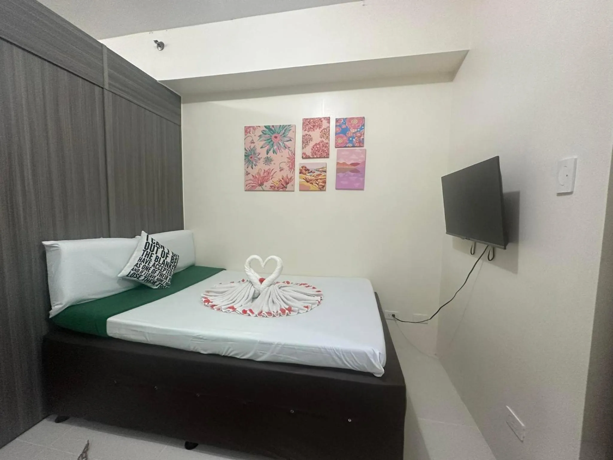 Bed in Green Residences Stays by PBYY