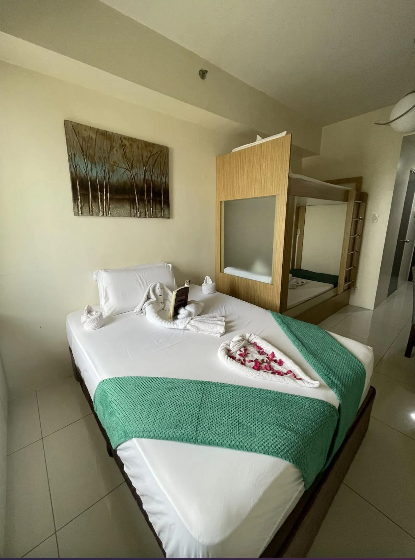 Bed in Green Residences Stays by PBYY