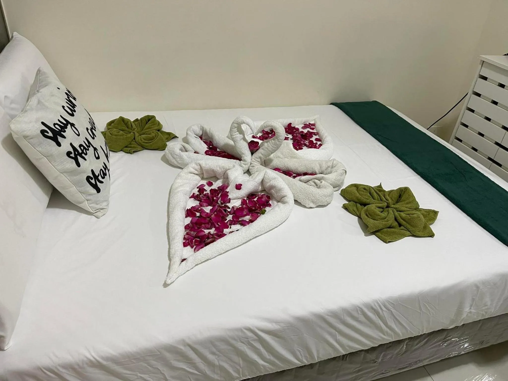 Bed in Green Residences Stays by PBYY