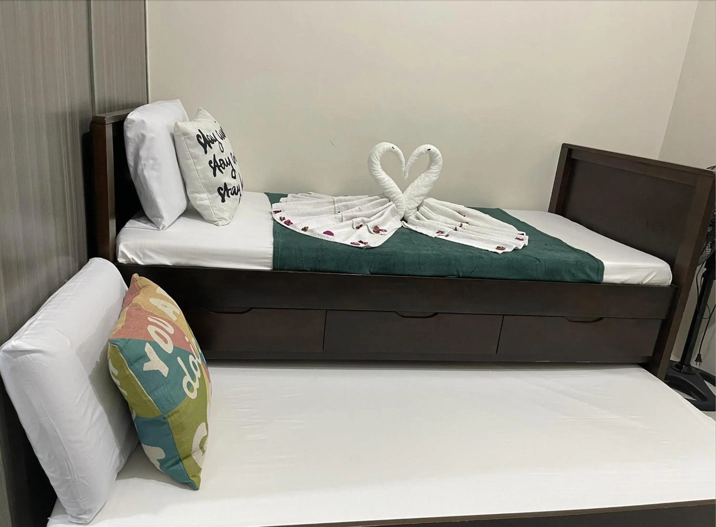 Bed in Green Residences Stays by PBYY