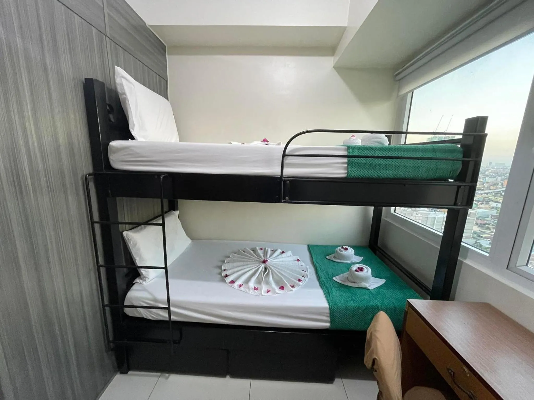 Bed in Green Residences Stays by PBYY